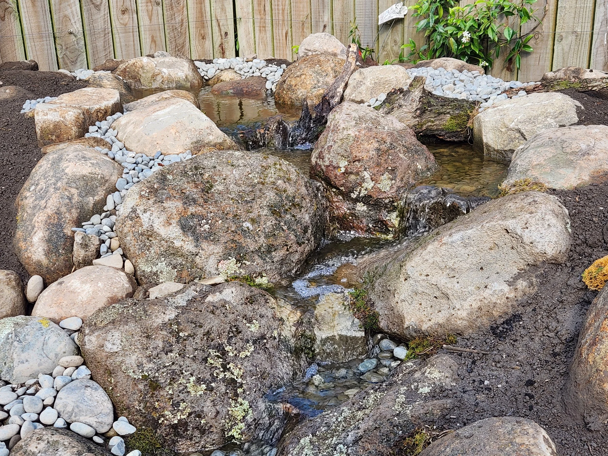 Custom pondless waterfall with natural boulder and stone placement — Southern Waterscapes Ltd, Selwyn Canterbury