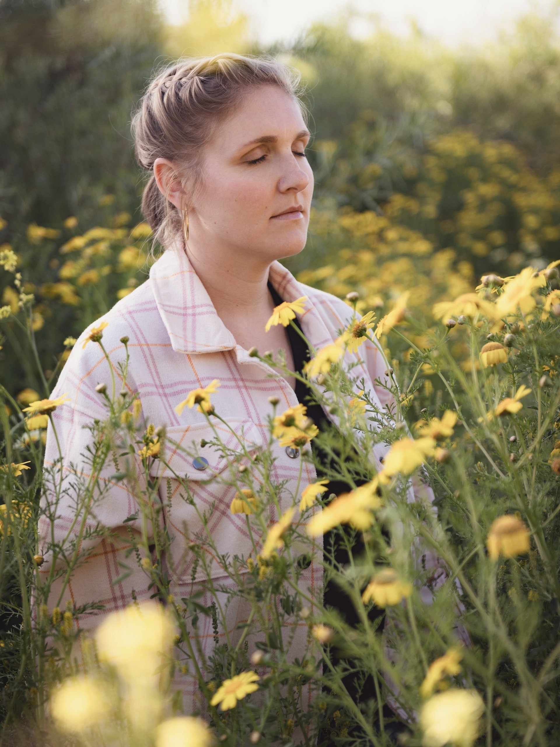 adult+woman+meditating+in+a+field+of+tall+yellow+flowers+%281%29.jpg