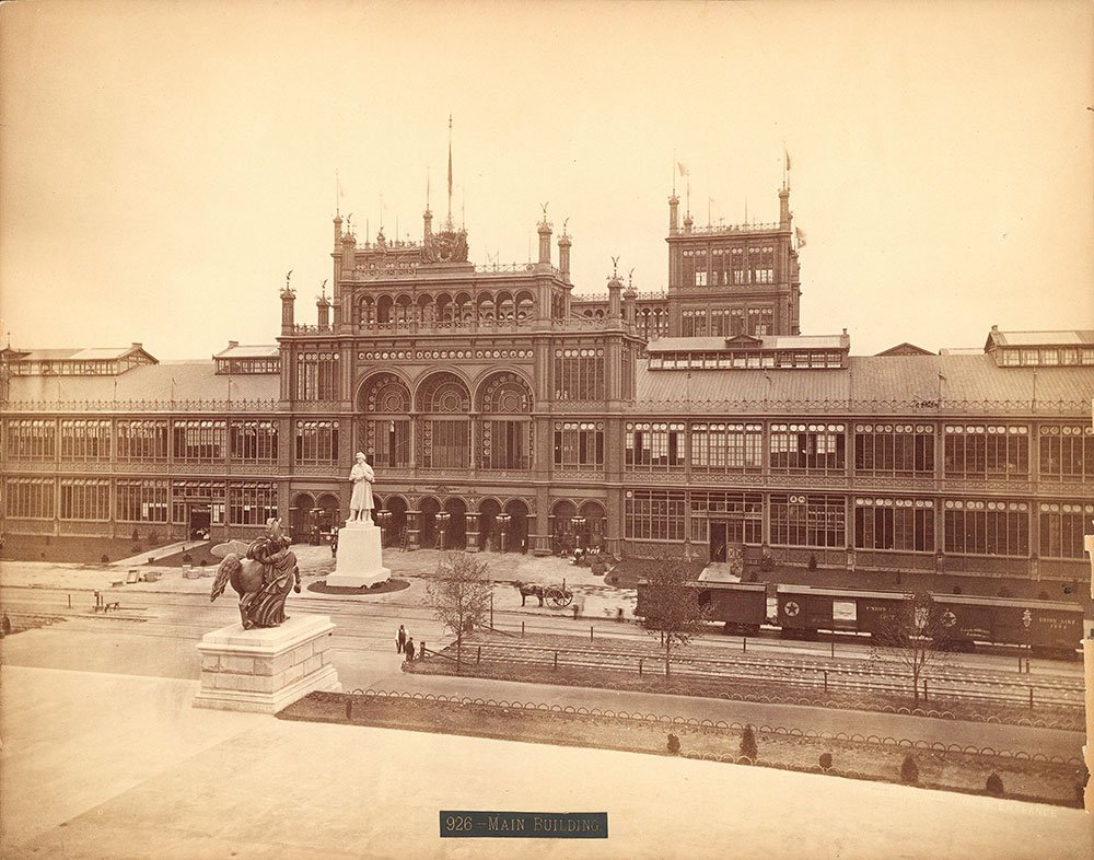The Main Building from the Centennial Exhibition. Notice the white Civil War statue out front. You have probably seen one of these before in your hometown. This sculpture debuted at the Centennial and became ubiquitous in America (Centennial Photogra