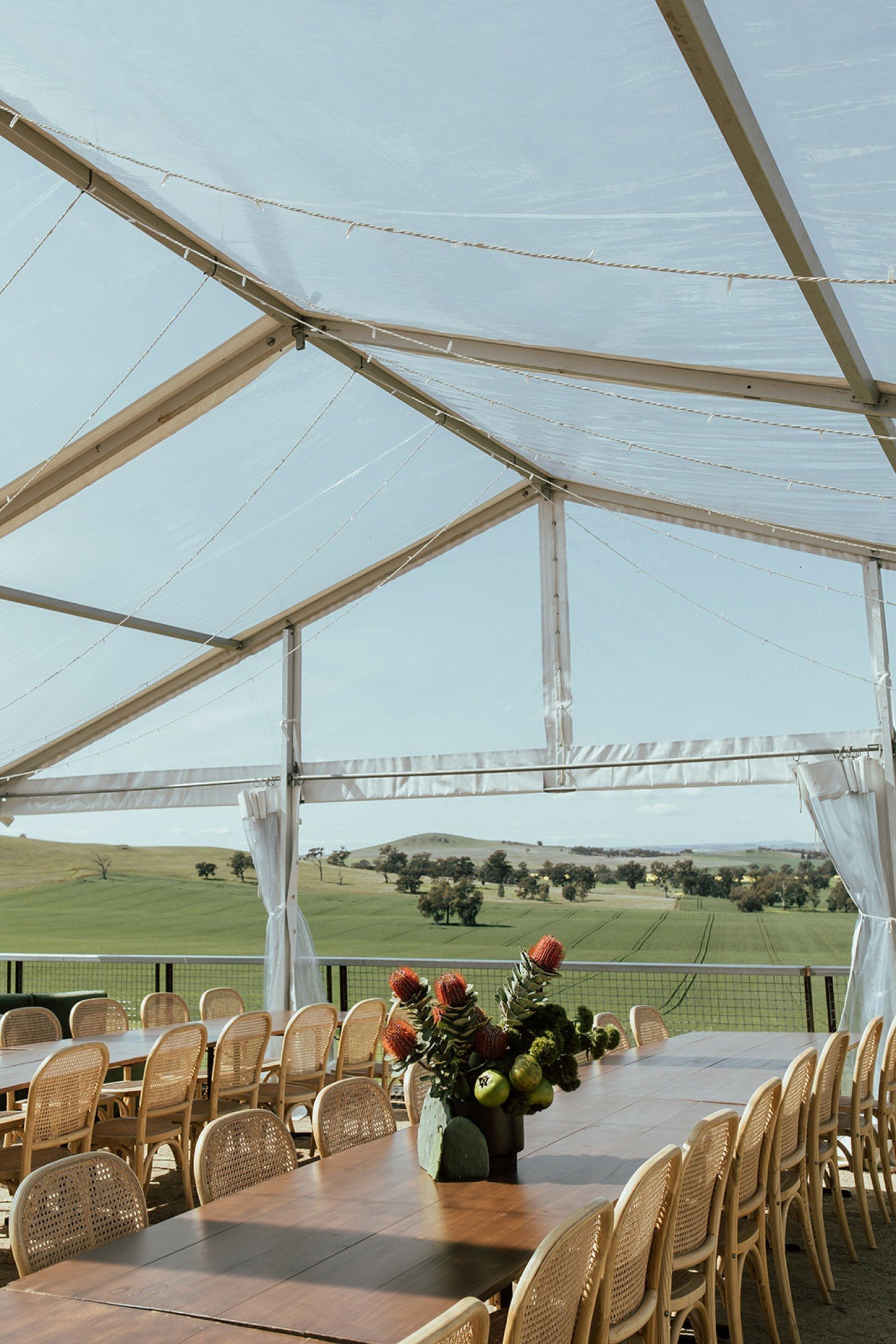 Overlooking the rolling hills of Dookie! 

The perfect spot for your next event with the team at @ryeattallis 

Featuring our clear marquee, timber trestles, timber rattan chairs, modular lounge, black soho cafe table and black arrow chairs

Styling 
