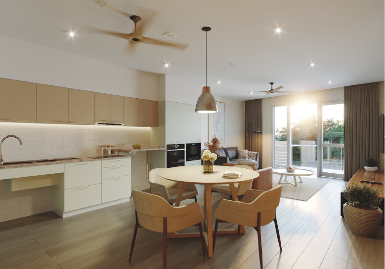Modern open-concept kitchen and living room with round dining table, four beige chairs, a sectional sofa, and sliding glass doors leading to a balcony, illuminated by natural sunlight.