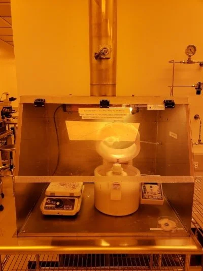 Laurell spin coater in the lithography bay of the cleanroom, used for applying uniform photoresist films to wafers.