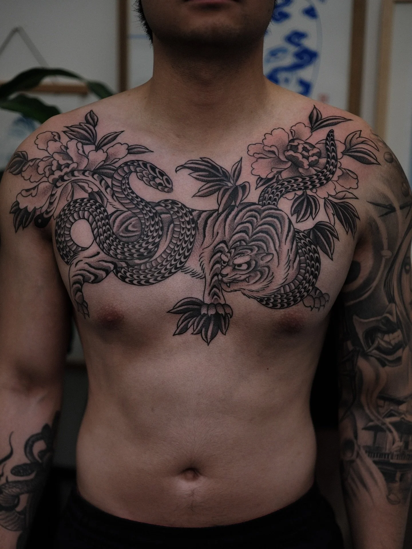 Tiger and snake chestpiece for Bao! Thanks bro!🔥🔥🔥 Completed in two sessions @chapeltattoo 

Book in a consultation via link in bio to chat about your next tattoo