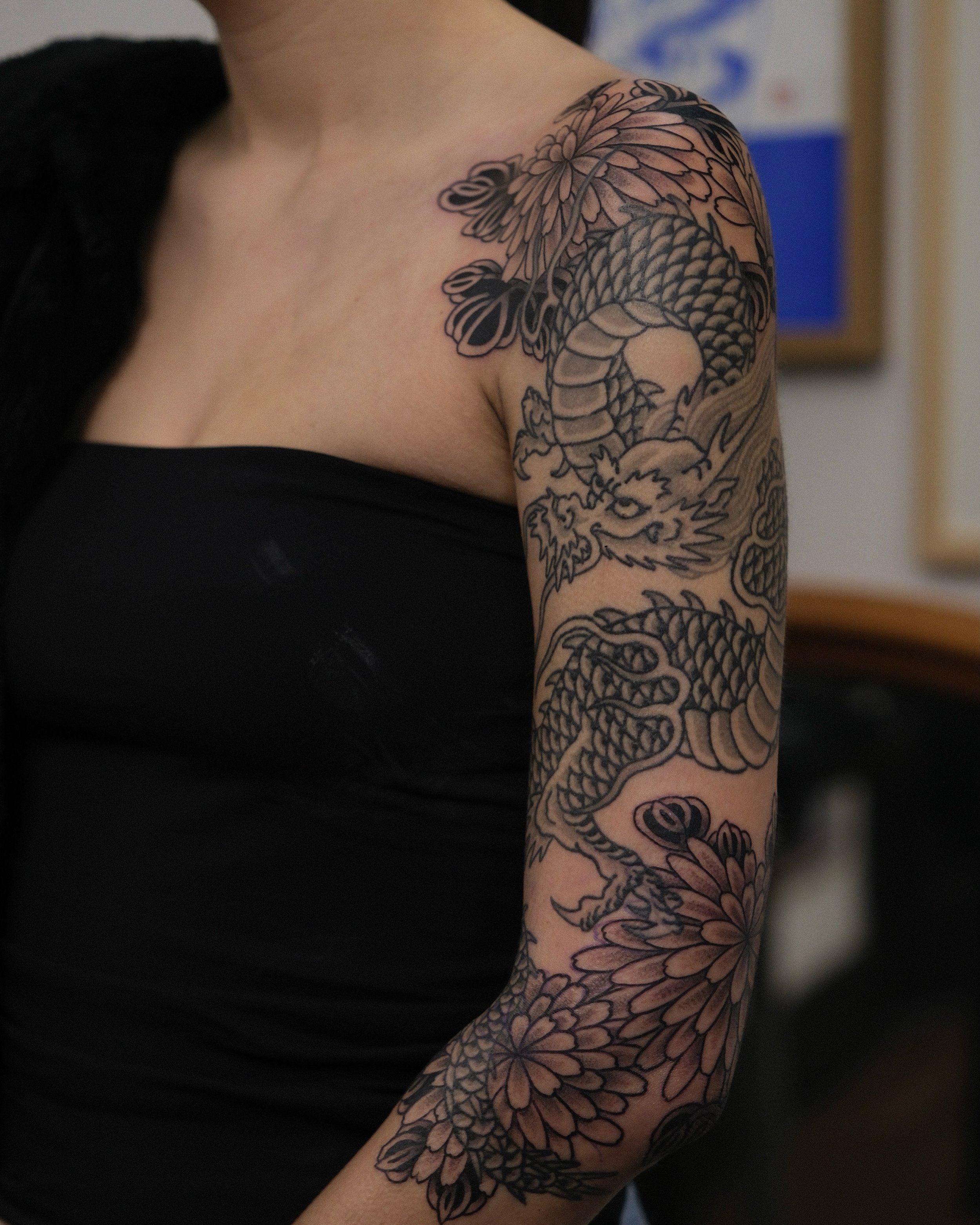Added some chrysanthemums to this dragon to fill out Cynthia&rsquo;s arm. Stoked with the outcome, thank you Cynthia! 
@chapeltattoo 
Bookings via link in bio ☺️
