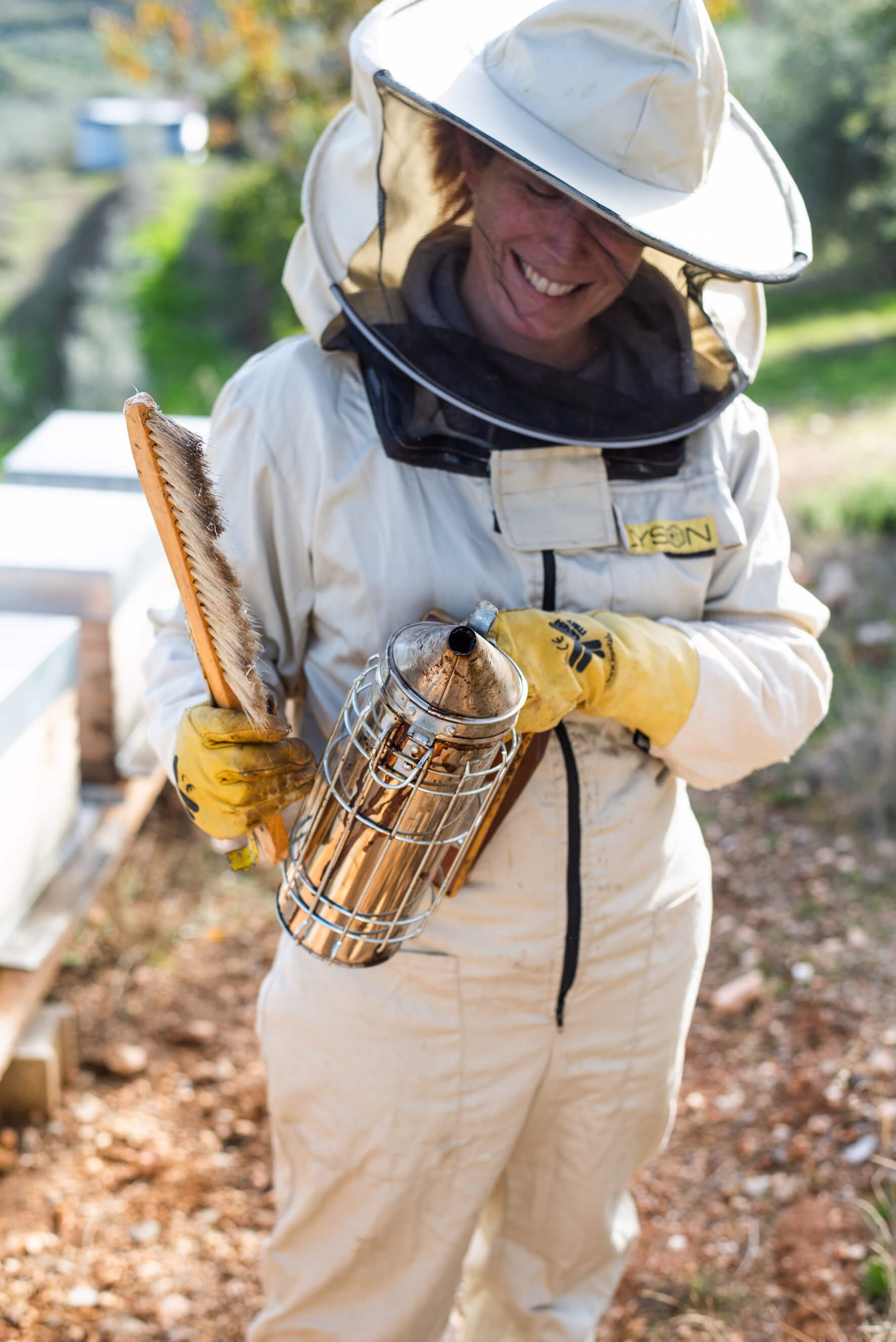Éme Beekeepers Marina caring for her hives