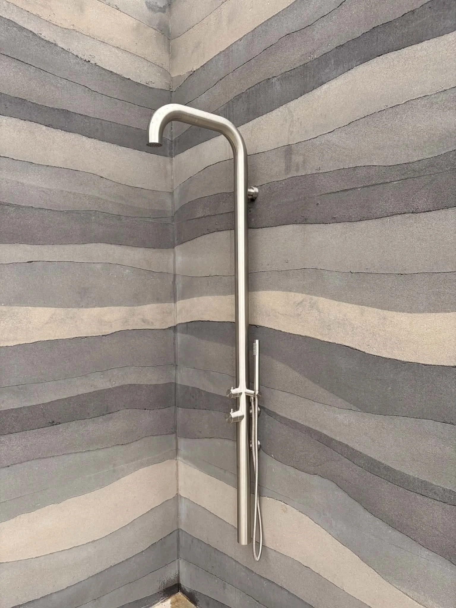 rammed earth outdoor shower