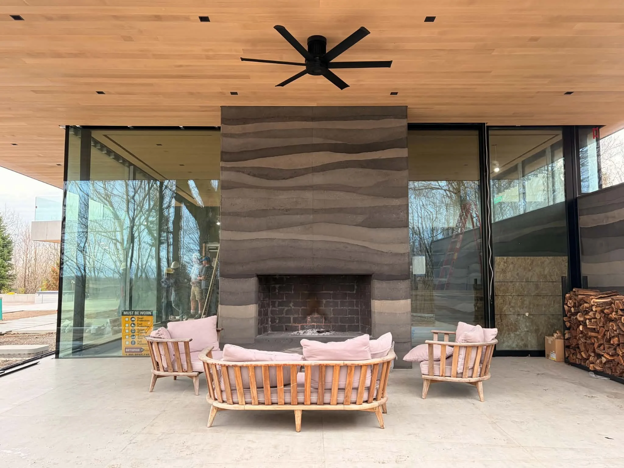 rammed earth outdoor fireplace
