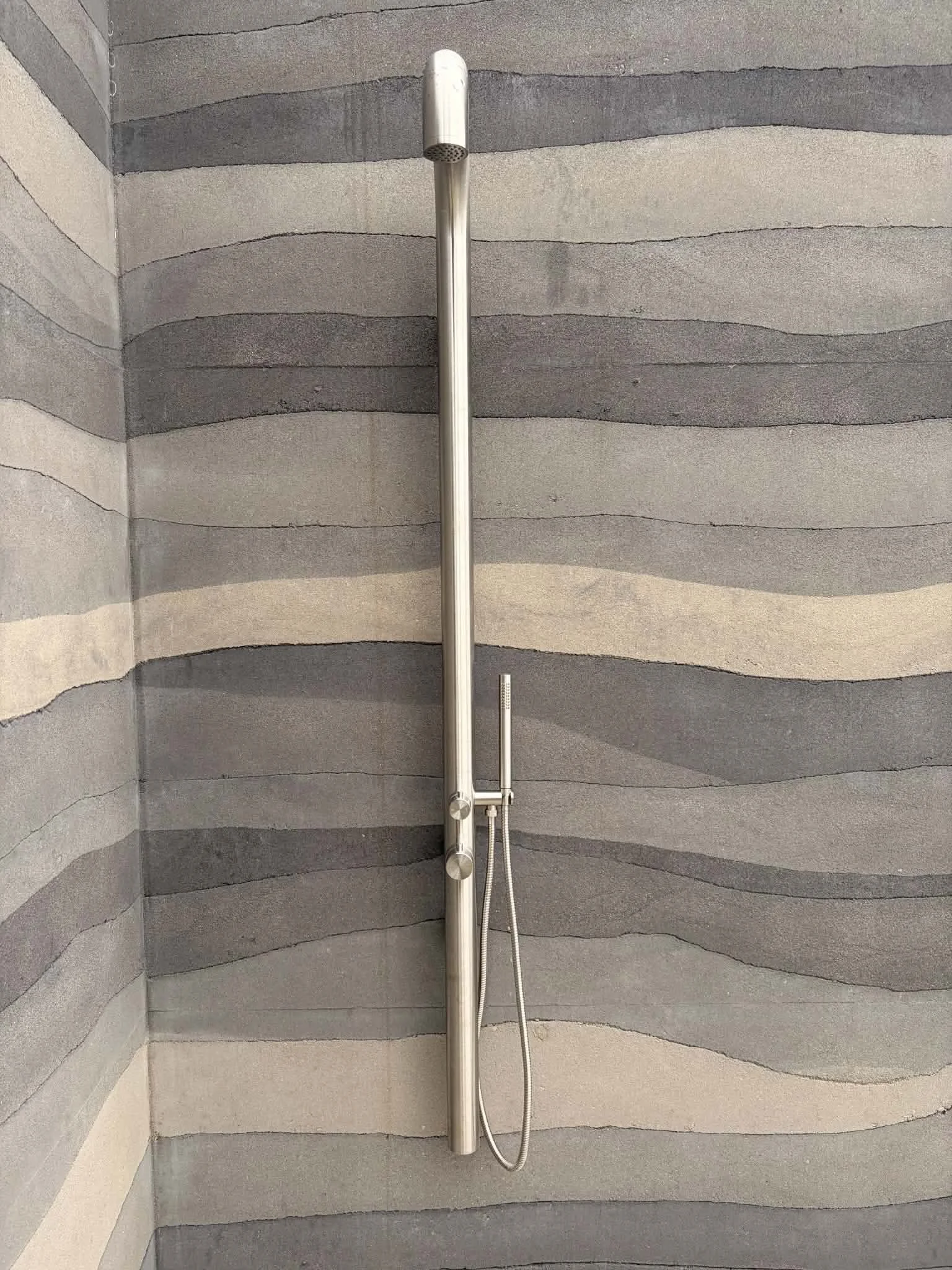 rammed earth outdoor shower