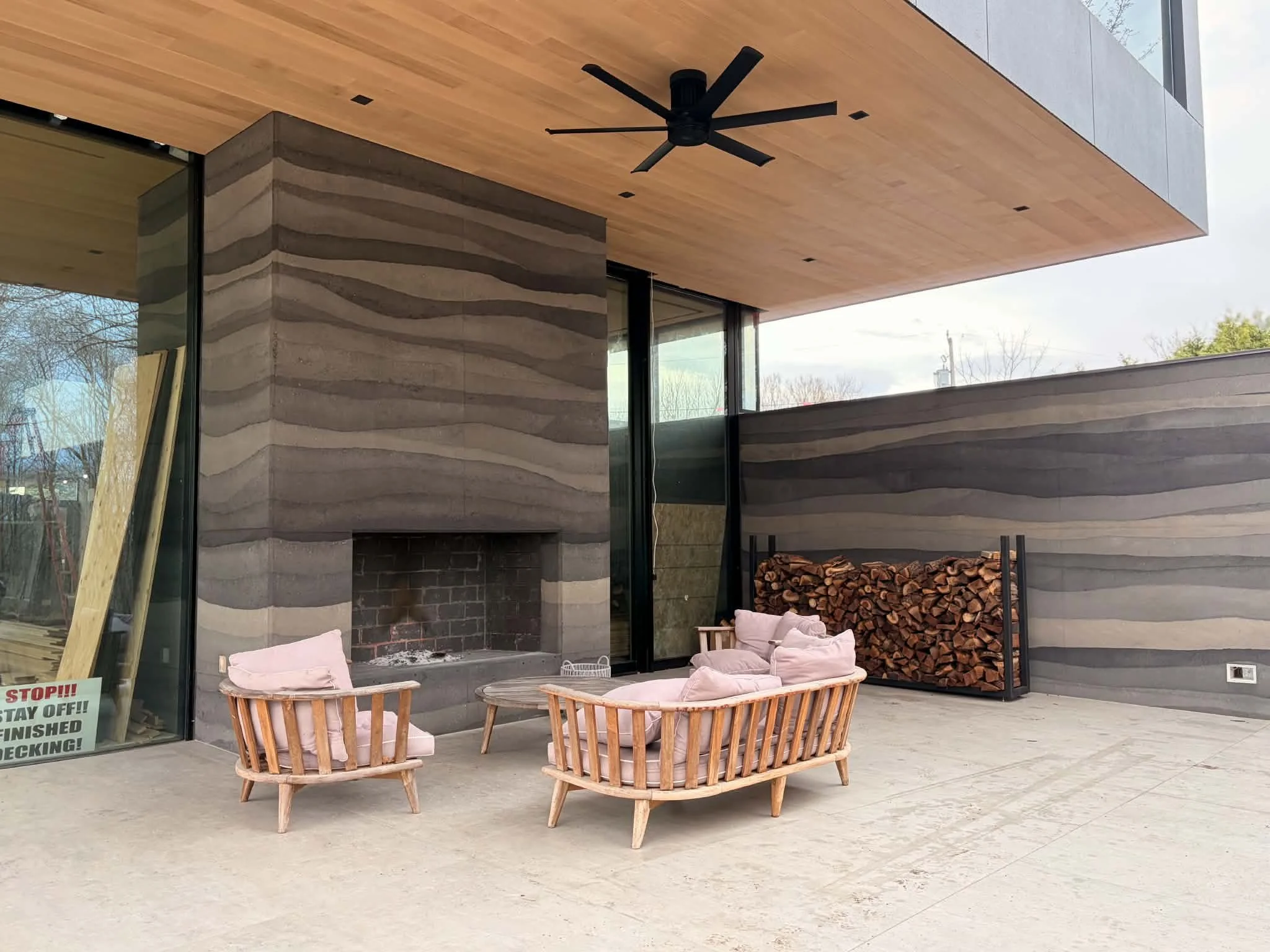 rammed earth outdoor fireplace