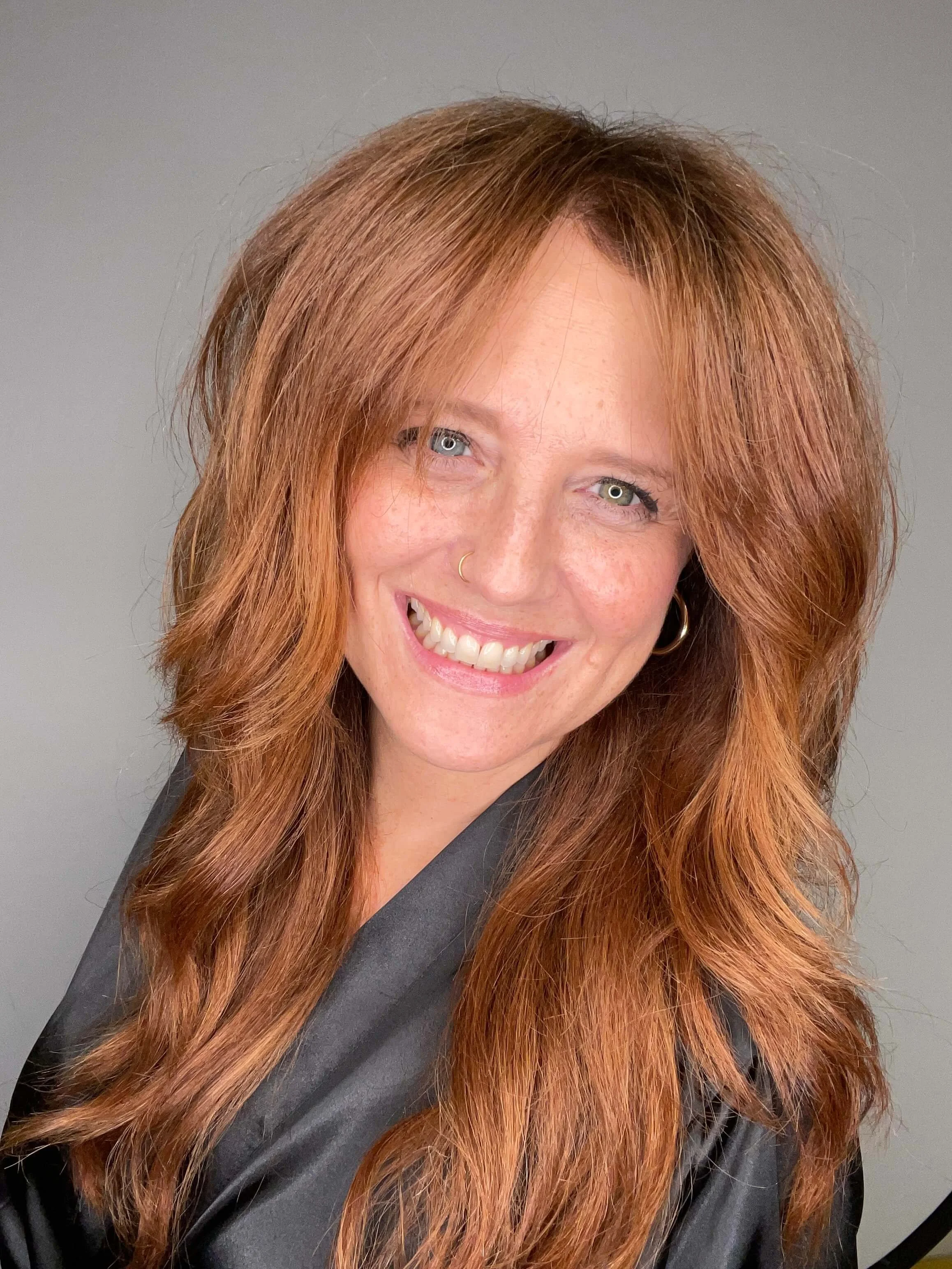 Suzi Watkins, Board Certified Trichologist specializing in hair restoration, hair loss, and thinning hair, at Root Revival Hair Restoration in Cumming GA.