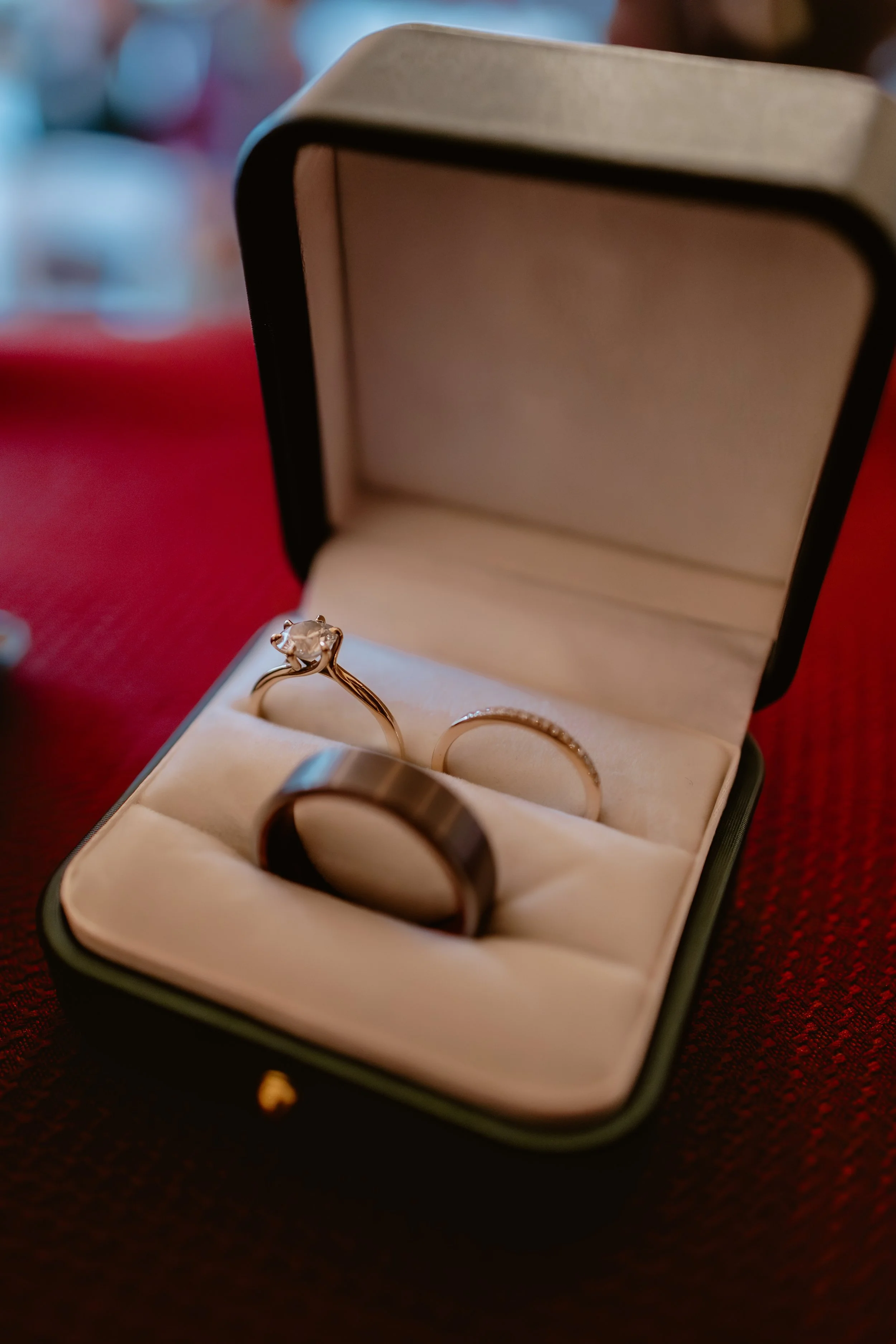 Wedding rings displayed in a ring box before a November wedding