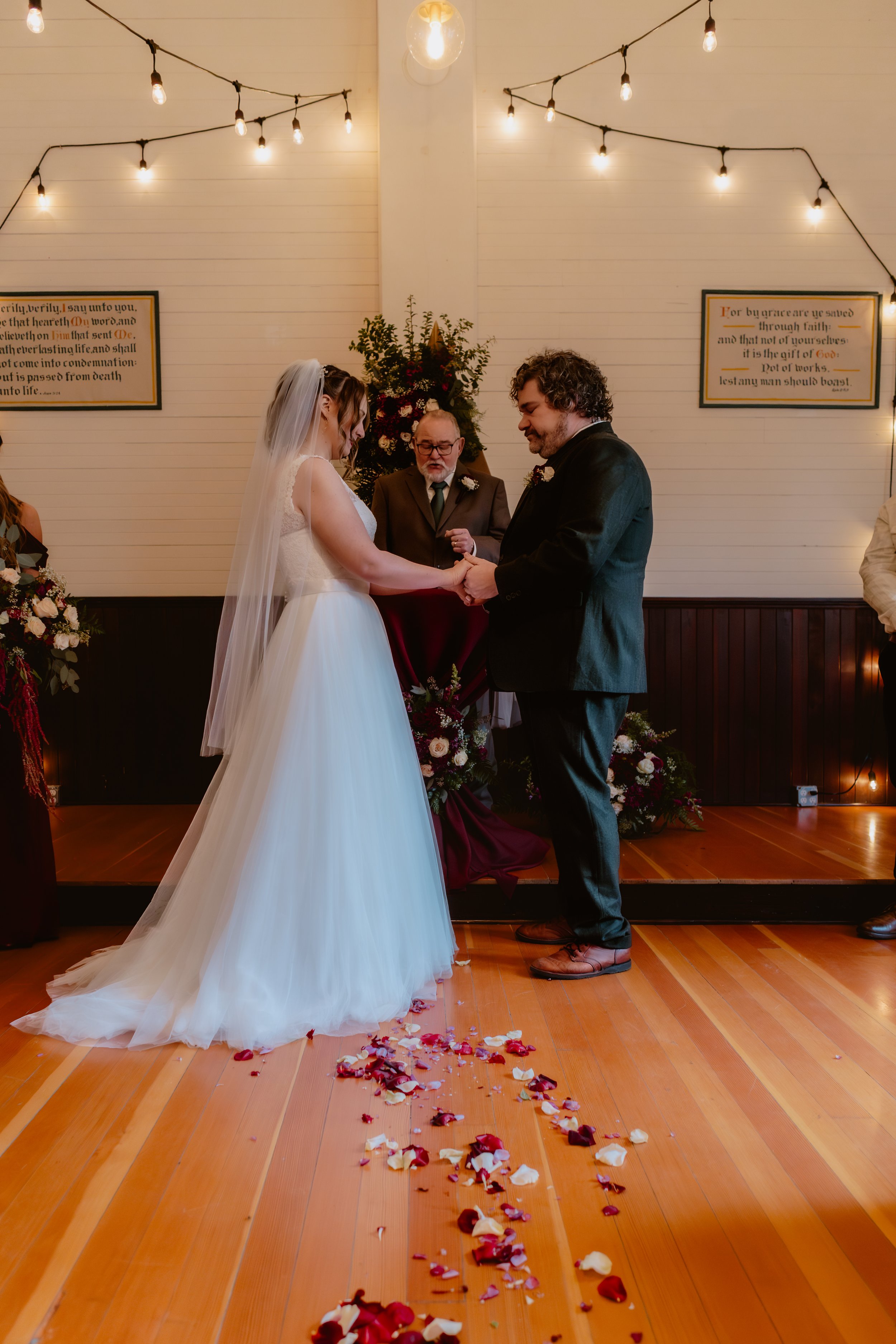Bride and groom exchanging vows inside Hummingbird Hall