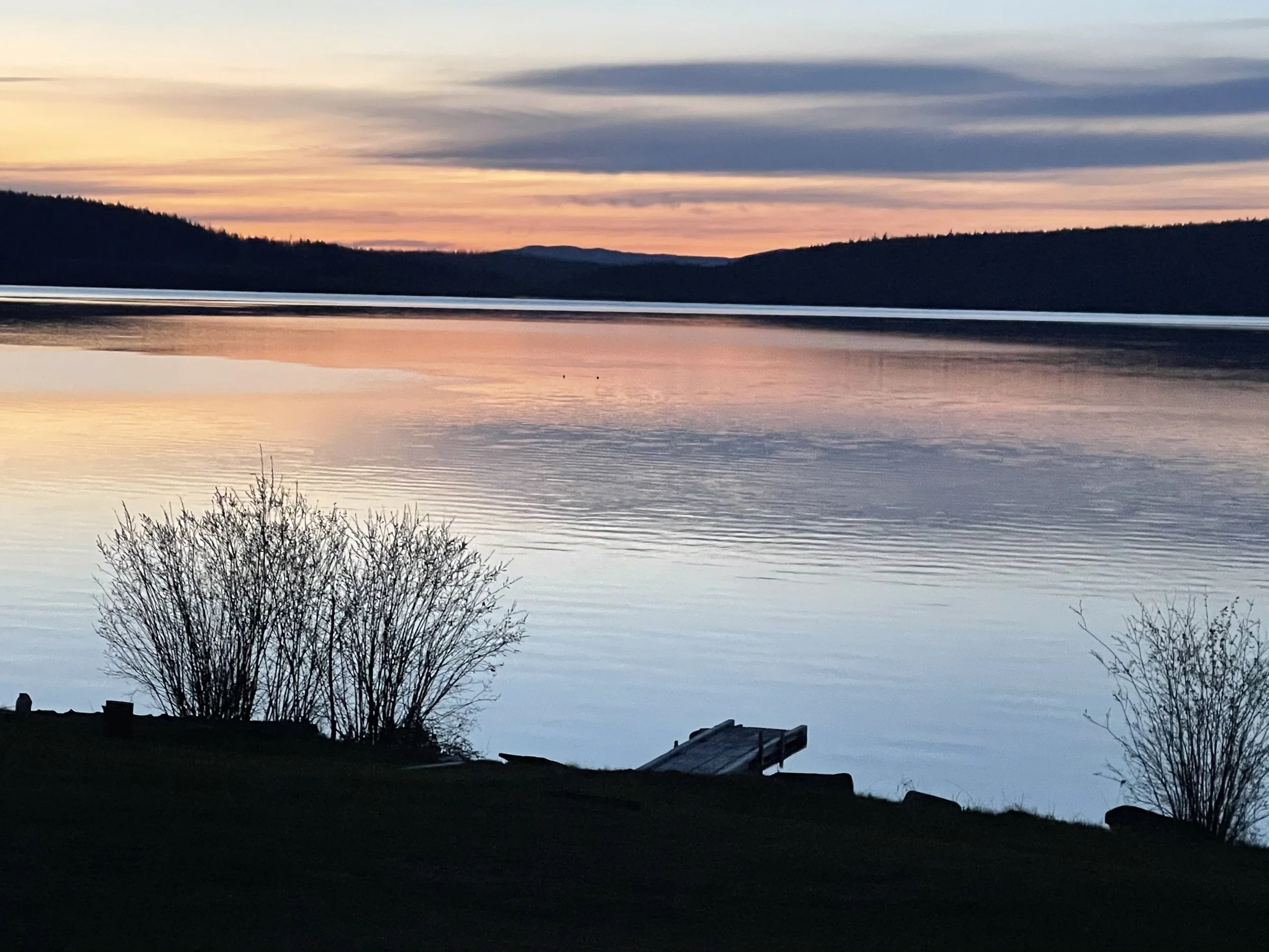 Peaceful sunset over Puntzi Lake at Woodlands Fishin Resort — the perfect end to a day surrounded by nature.