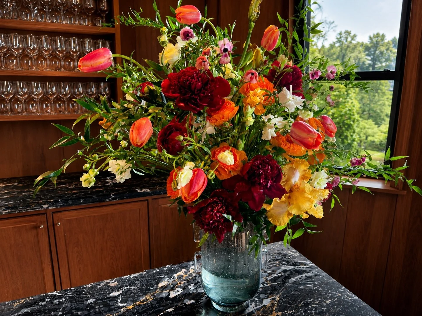 A Renaissance-inspired floral study, composed in shadow, color, and movement.

Deep crimson, golden yellow, coral, ivory, and painterly greens come together like a living still life &mdash; designed for an evening devoted to classical music, drama, a