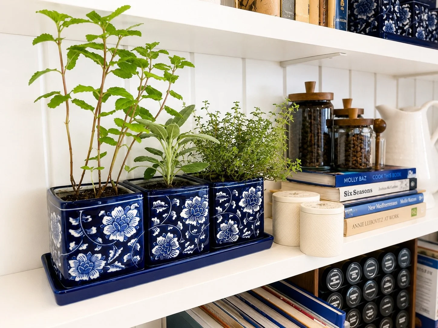Fresh herbs, collected cookbooks, and layered blue-and-white details &mdash; proof that functional spaces can still feel beautifully curated. Styled by Cottone &amp; Co for a kitchen that&rsquo;s equal parts lived-in, elevated, and ready for entertai