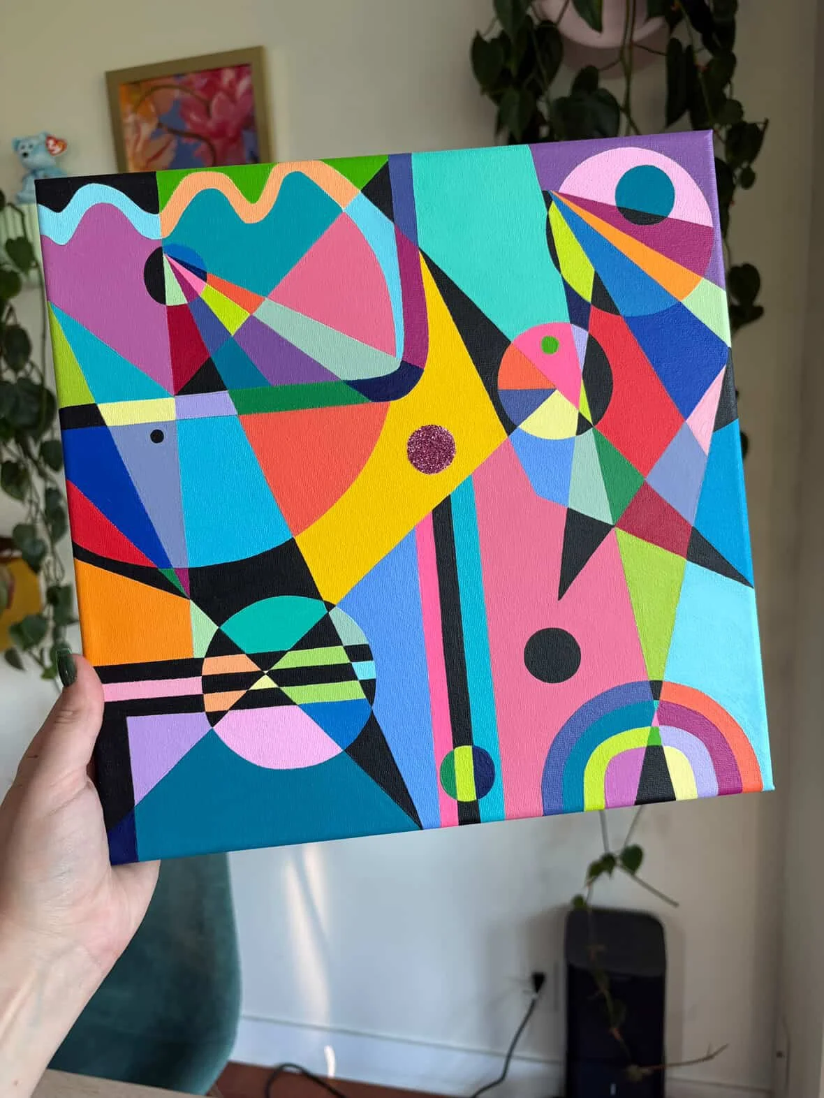 Colorful abstract geometric painting with various shapes and vibrant colors.