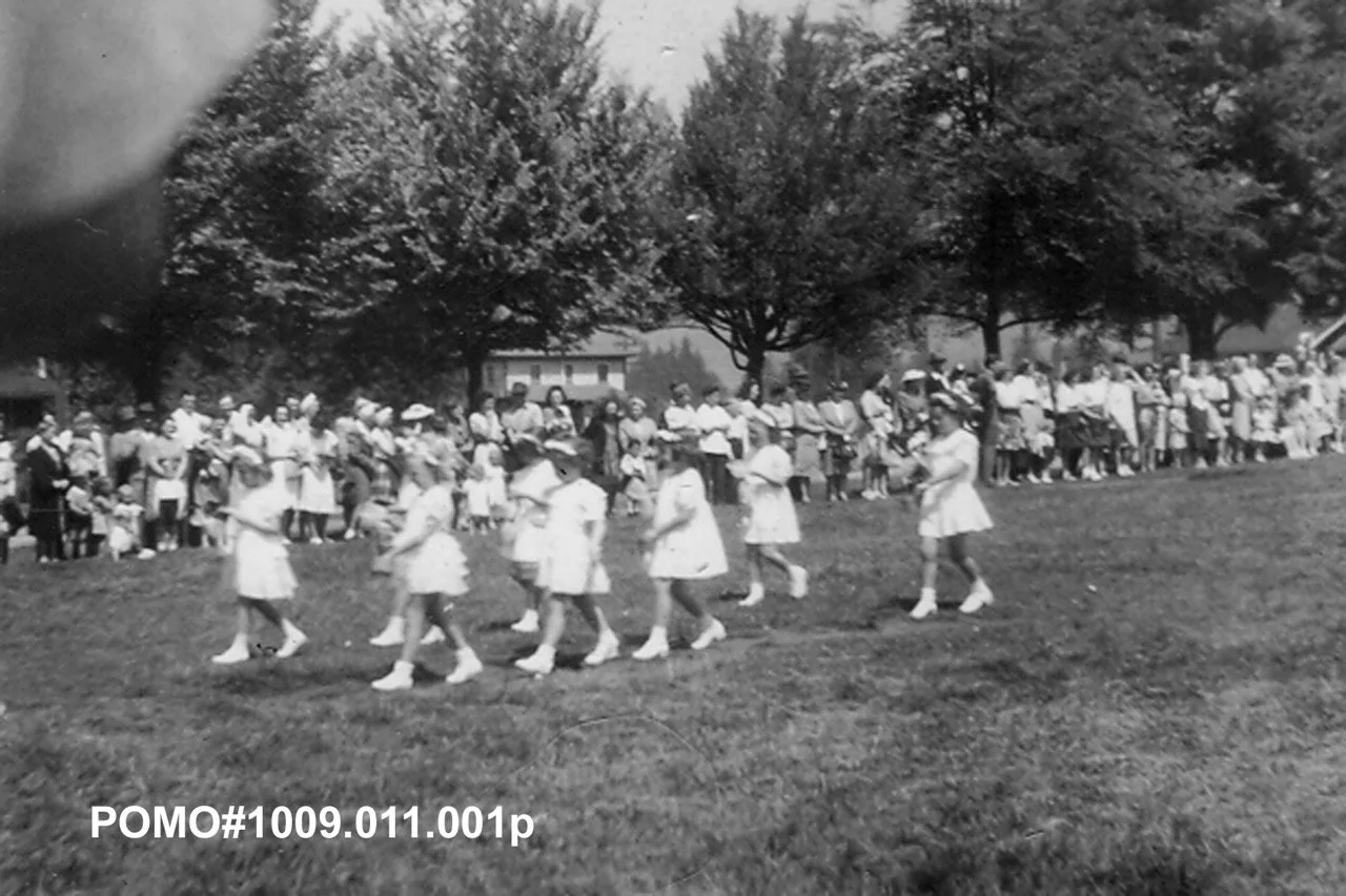 POMO# 1009.011.001p
Port Moody May Day, 1947, the May Queen’s court walking along the grass.