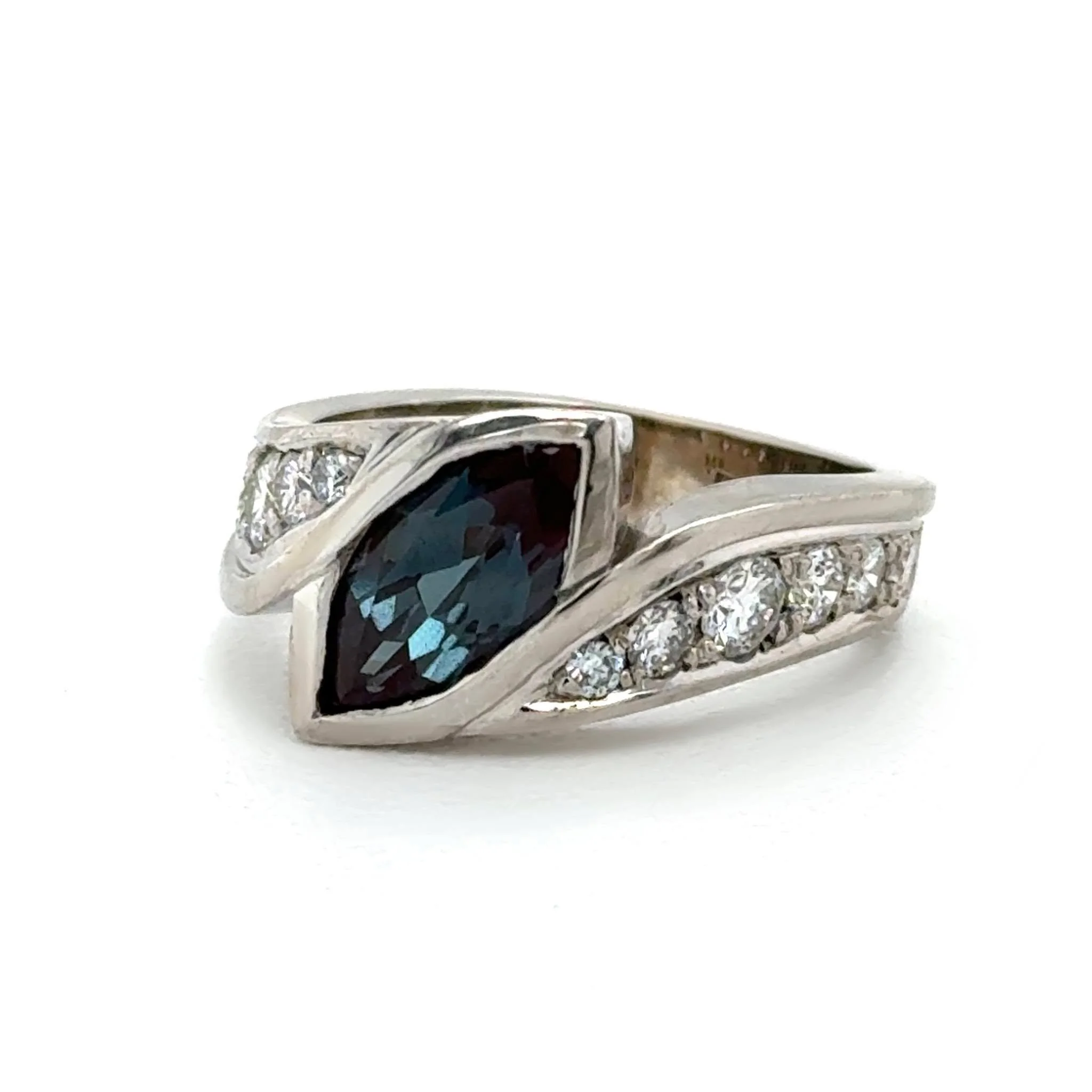 To celebrate their anniversary, this sweet couple wanted a fresh wedding set that still held the memories of their original rings. We incorporated her old diamonds and stones from other sentimental pieces, centered around a stunning lab-created Alexa