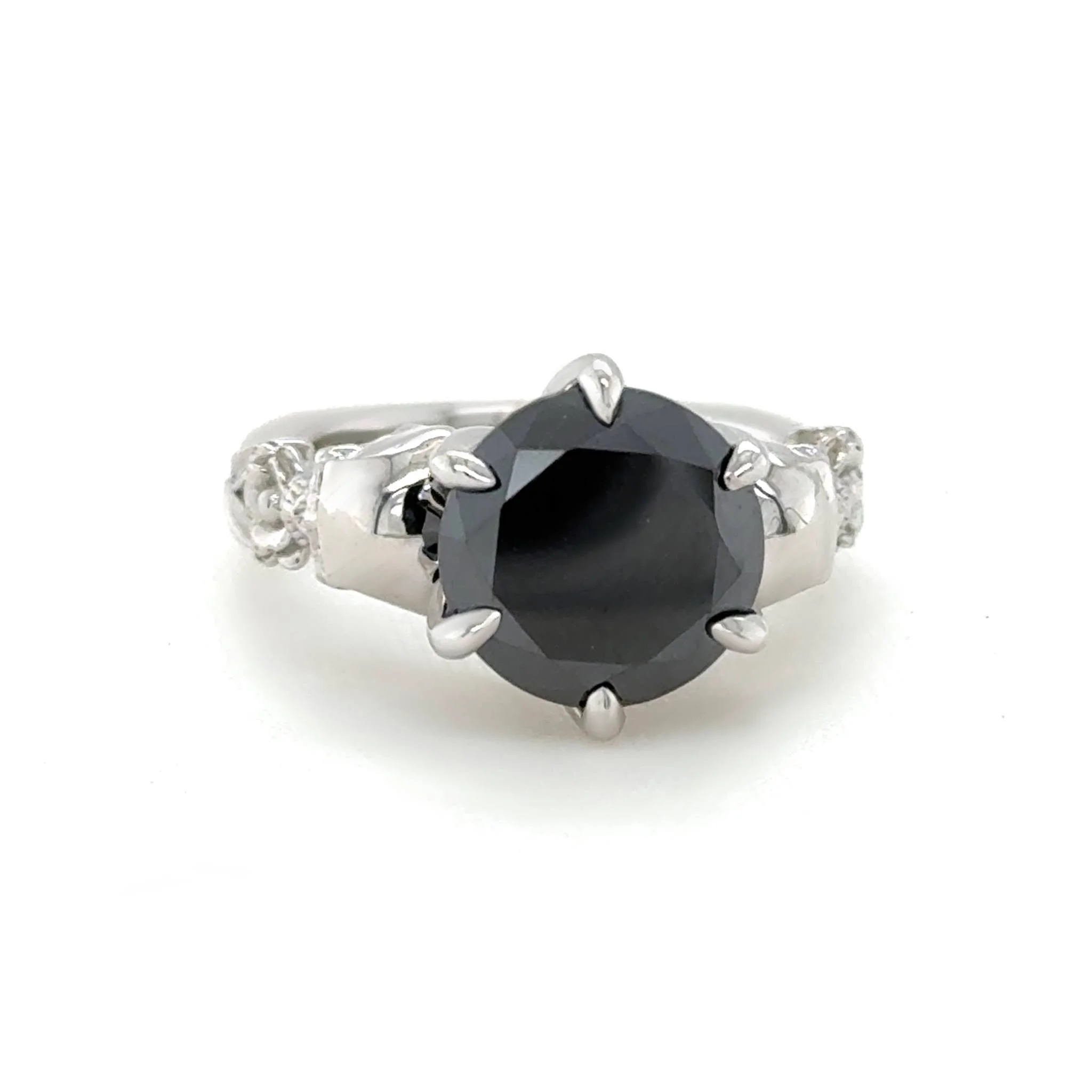 Beautiful with a dark side is the best way I can describe this ring. The black moissanite, paired with skull and rose details, brings just the right amount of edge. This one was a blast to design.🖤🌹

 #CustomMadeJewellery #QualityIntegrityCraftsman