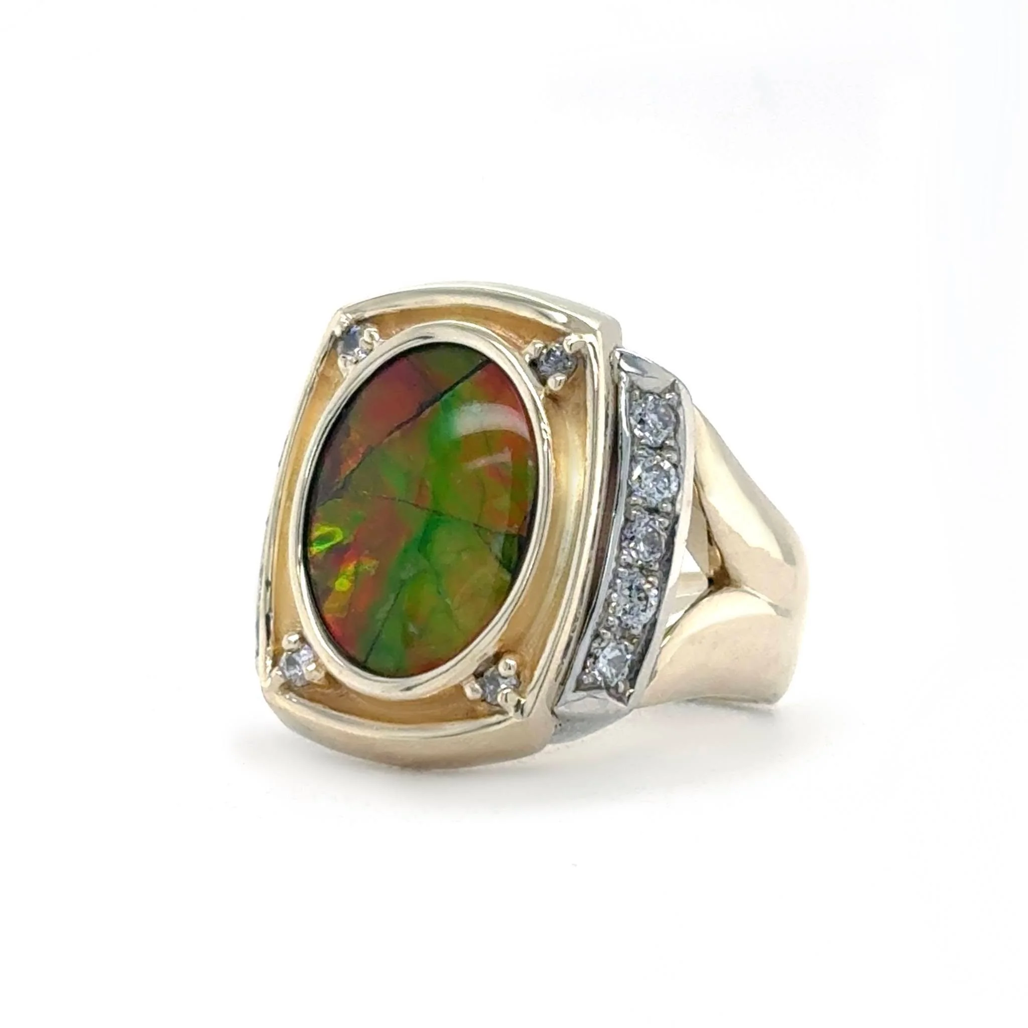 The goal for this piece was to preserve a piece of an old favorite while creating something new! 

We took the top of an ammonite ring we created years ago and gave it a completely new life as a ladies&rsquo; ring, incorporating the customer's own st