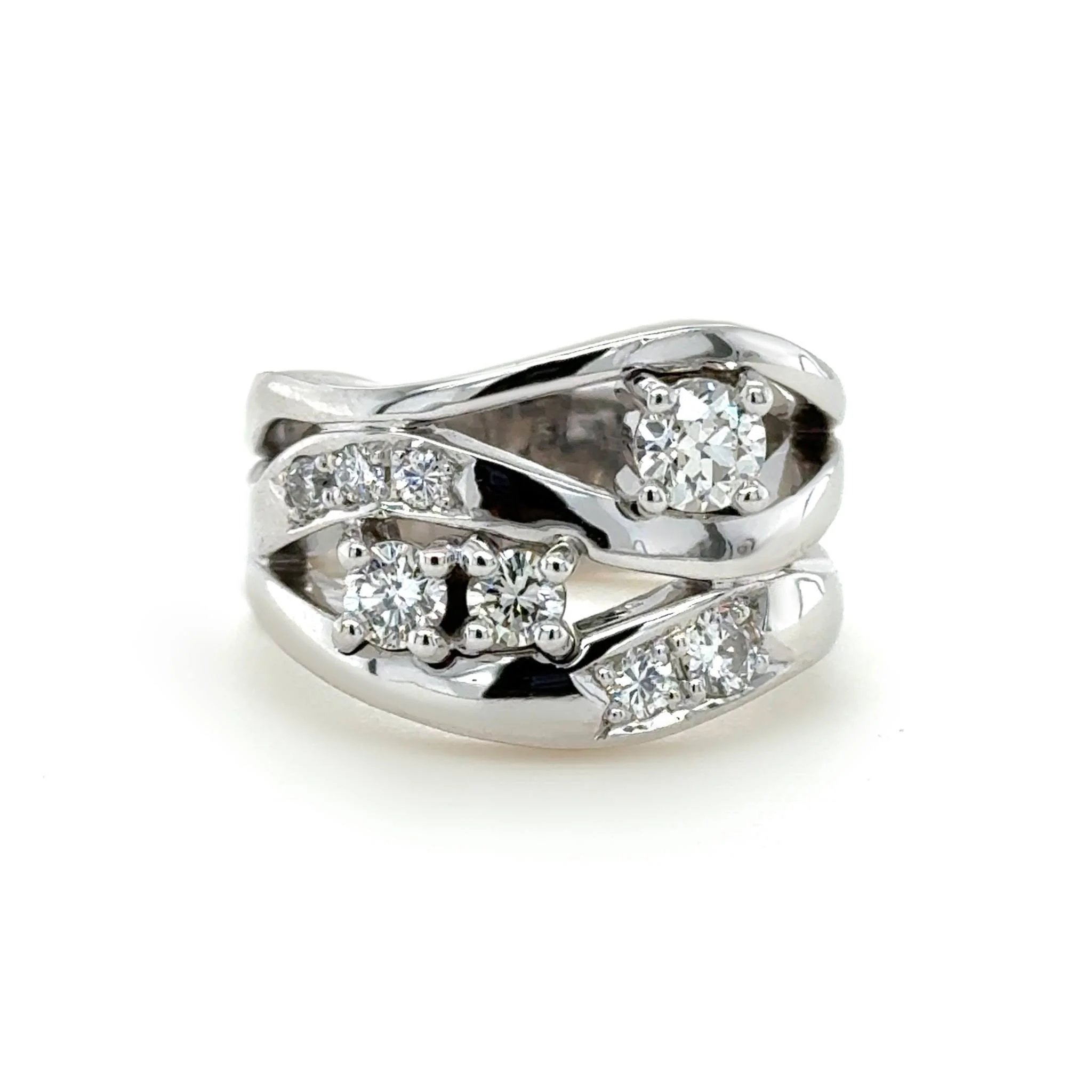 We took this customer's existing stones and built them into this fun, flowing multi-band design.

Each band works together to create one cohesive look, giving the ring plenty of movement and personality without feeling overly structured.