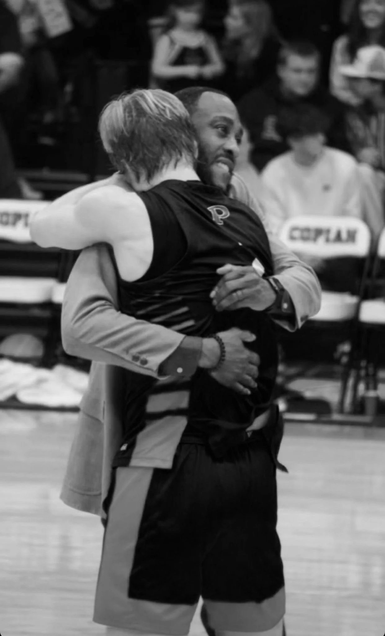 coach-alex-ainsworth-brewer-carruth-hugging-state-championship.jpeg