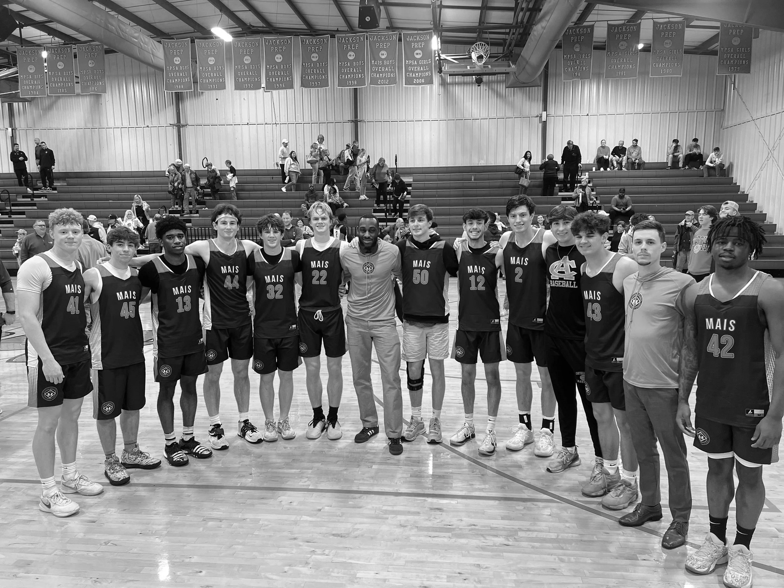 coach-alex-ainsworth-coaching-MAIS-basketball-game.jpeg