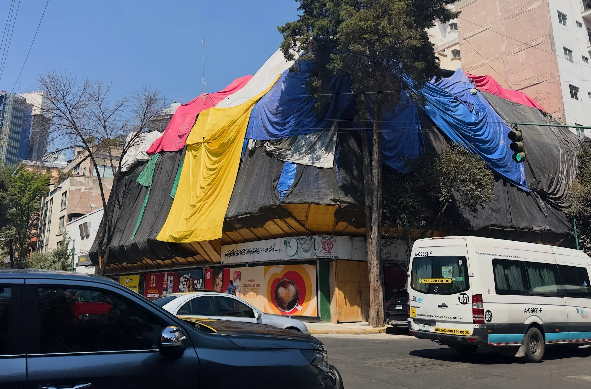 Funny how the tarps are layered over a building having some work done.