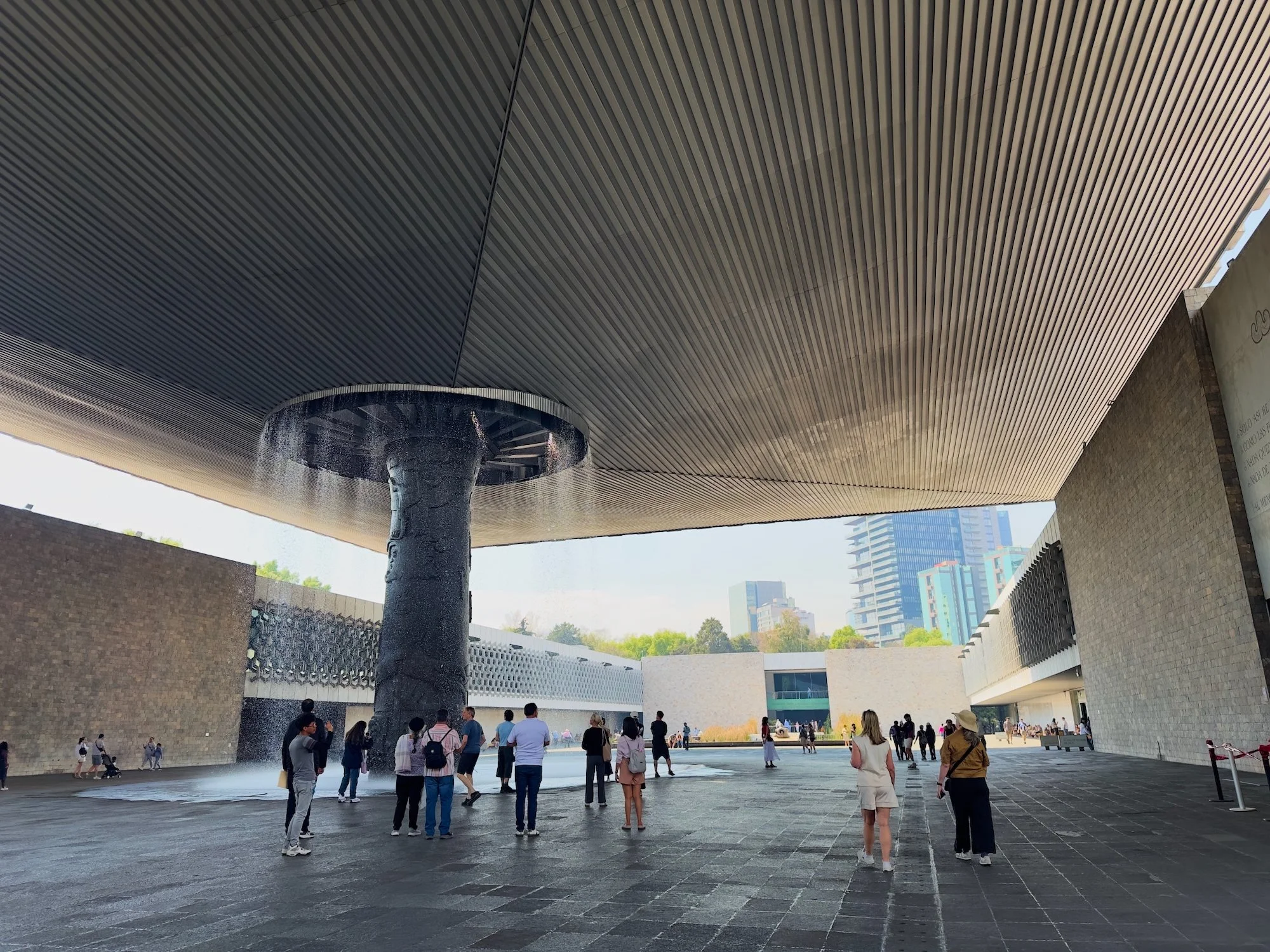 National Museum of Anthropology: An amazing roof over the courtyard. The whole roof is supported by the central column, which is also a waterfall.  