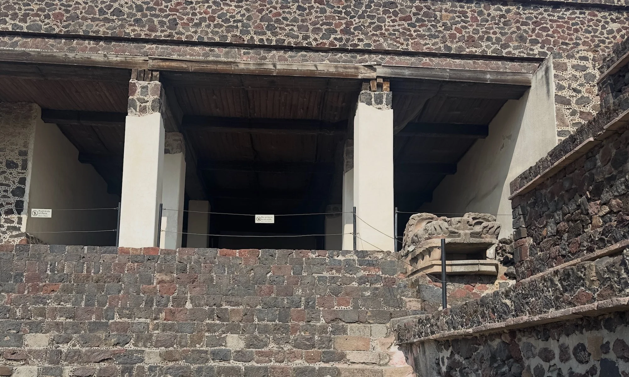 Teotihuacán: This is the entrance to a side temple facing the main plaza. It was engineered to that when it rained water rushed out of the serpent head on the right. 
