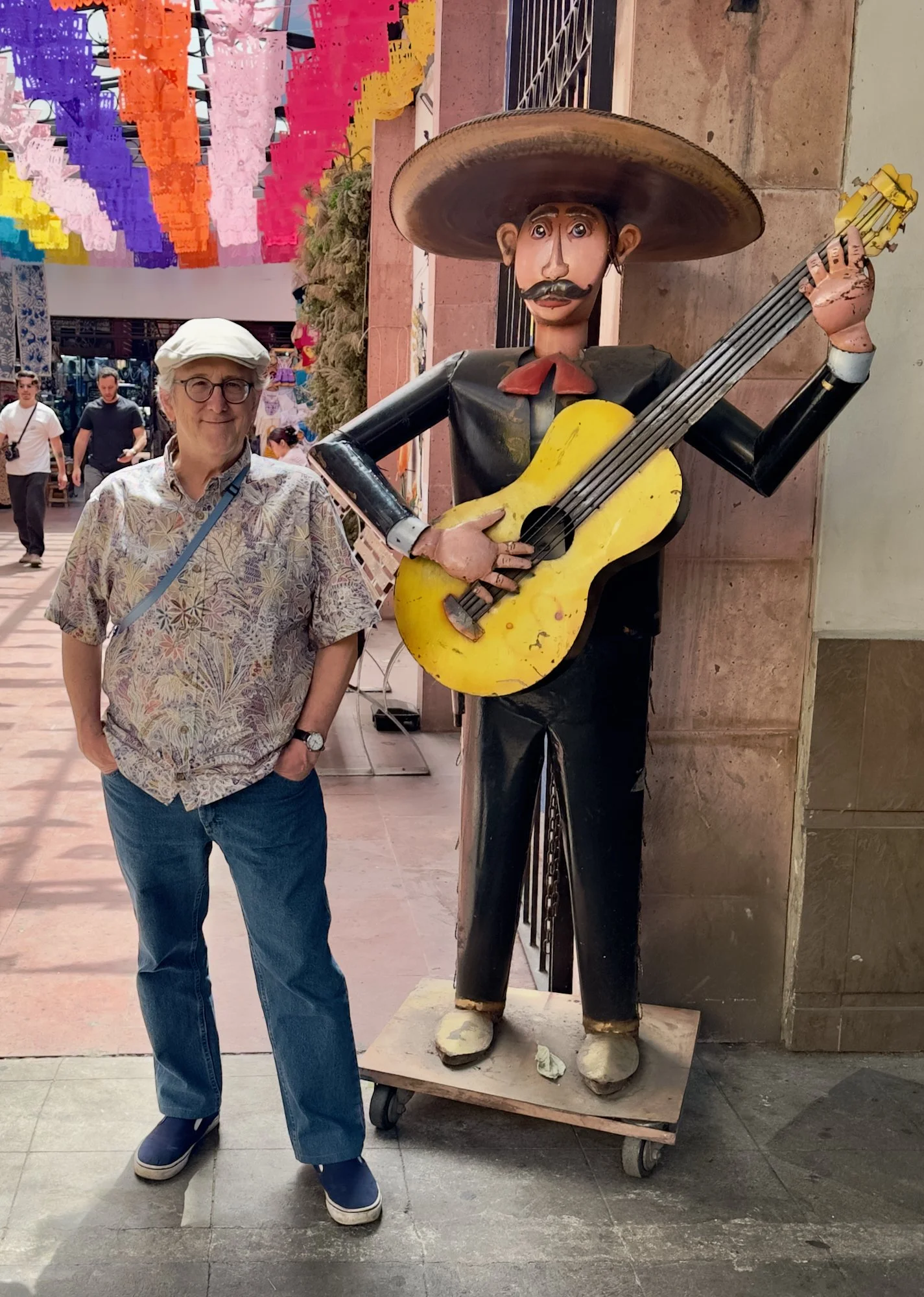 Yours truly standing by a guy with a guitar.