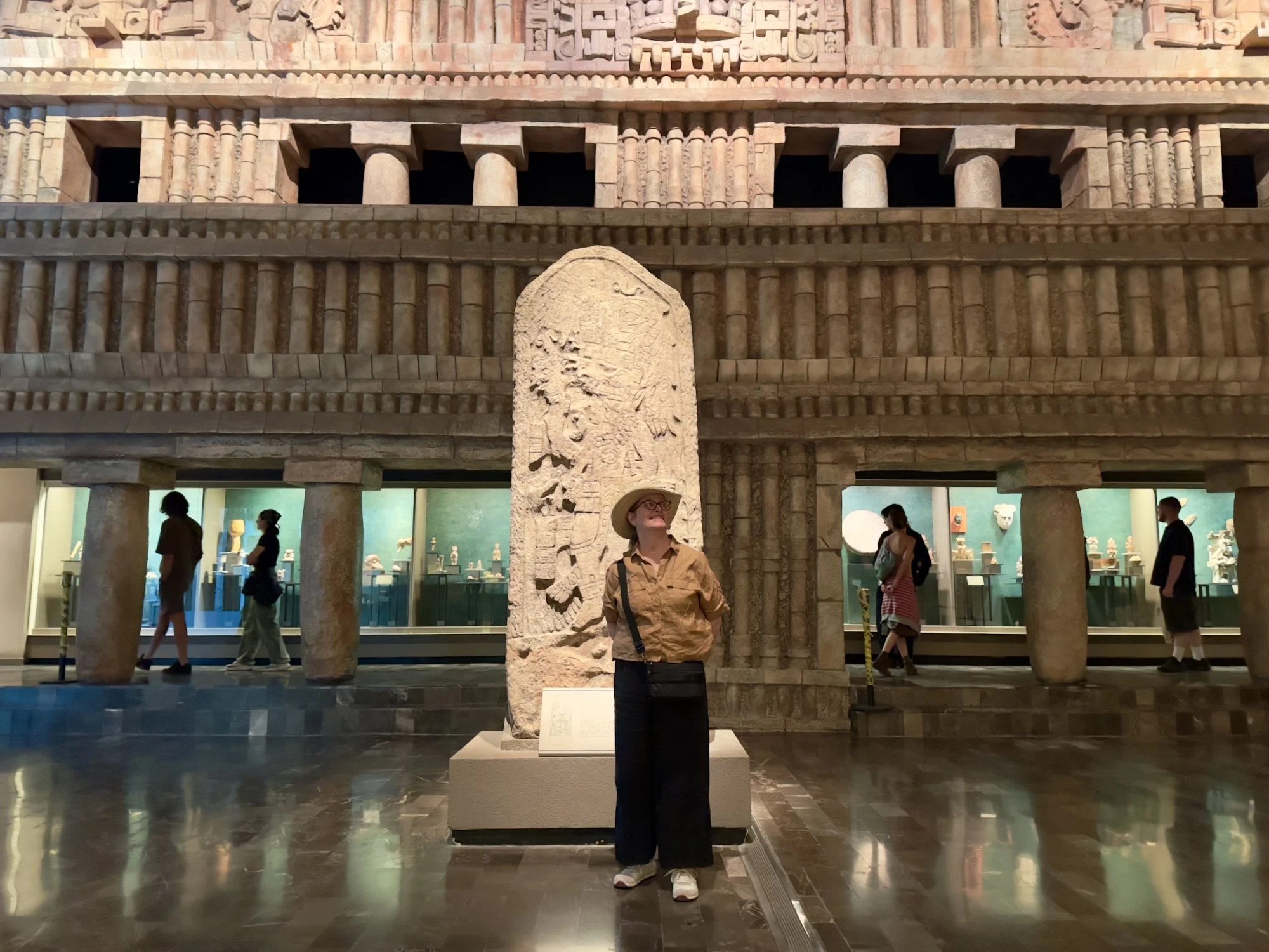 National Museum of Anthropology: Beth looking like an explorer in front of a massive part of a temple.