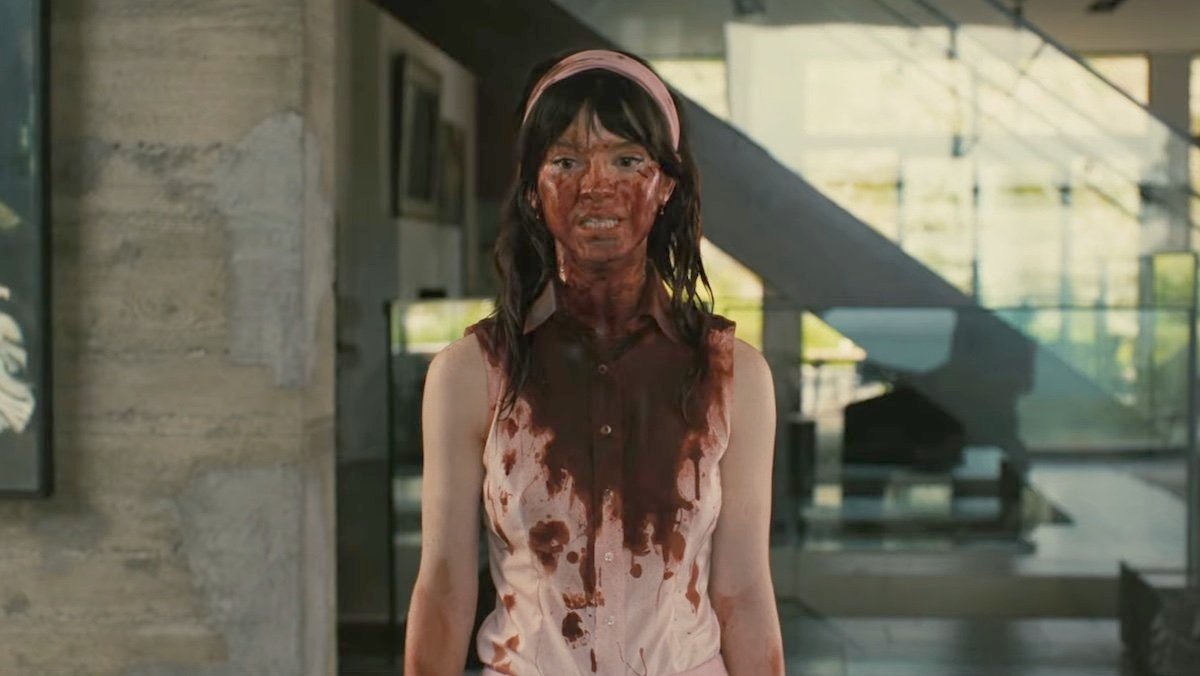 Sophie Thatcher in Companion, covered in blood