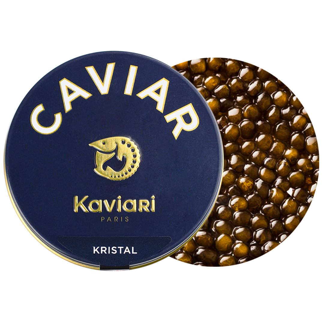 Round tin of Caviar Kaviari Paris Kristal with caviar beads in the background.