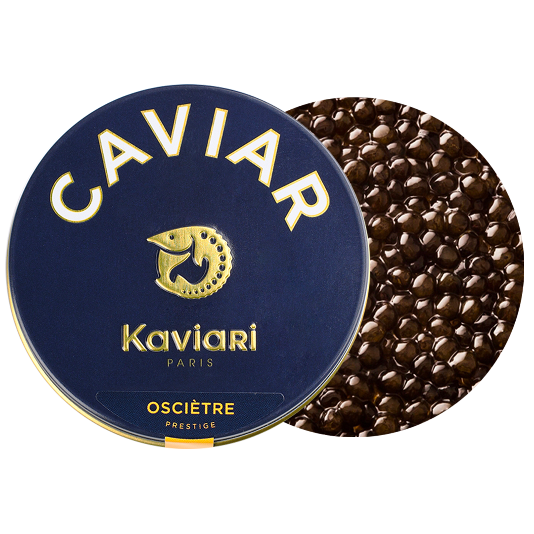 A tin of Kavkári Oscietre Prestige caviar with some black caviar surrounding it.