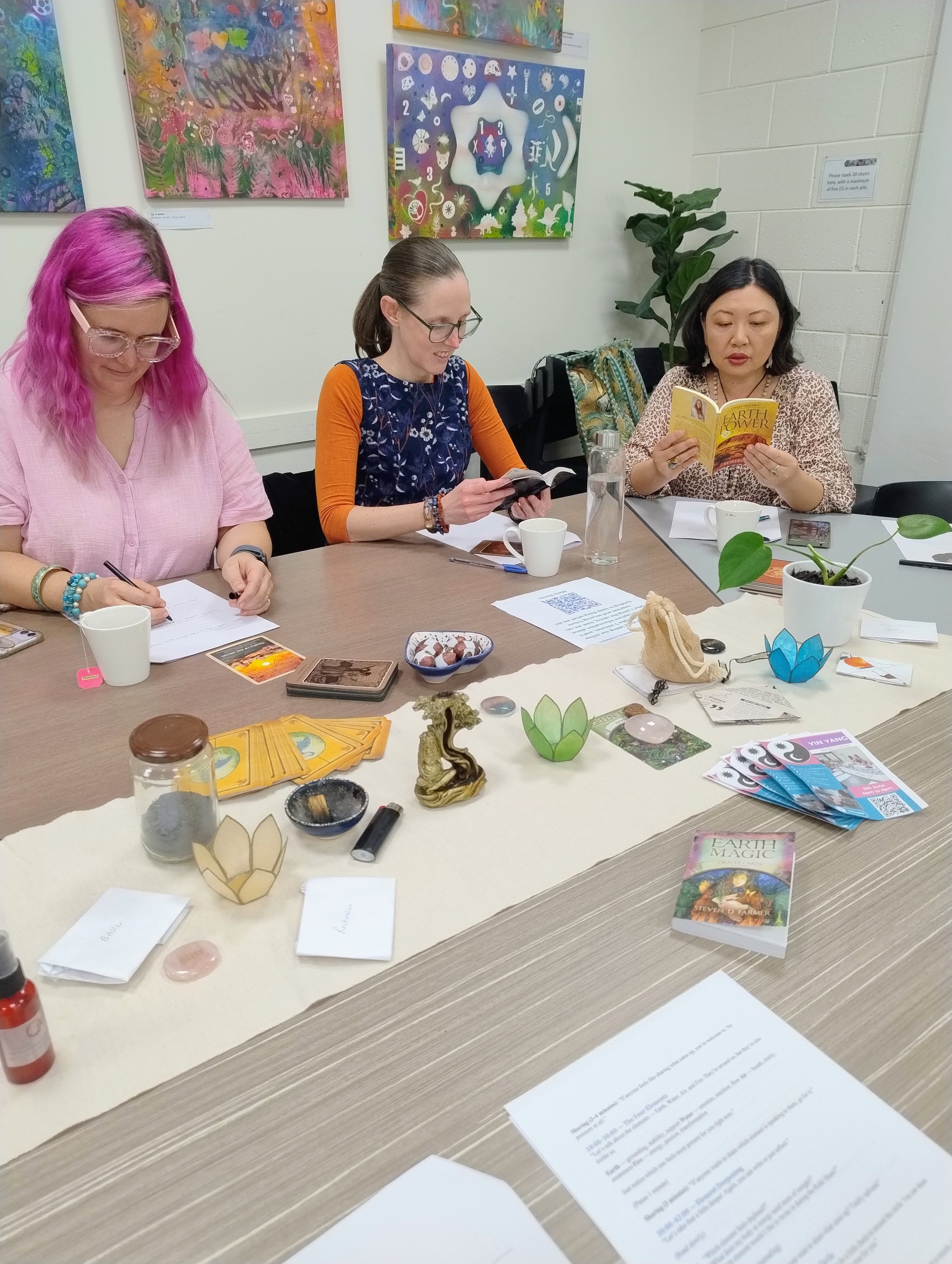Participants at Reiki Share Adelaide completing reflection workbook.