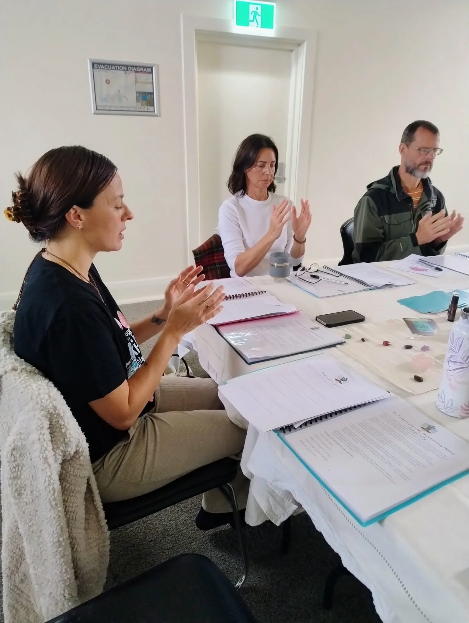 Students learning to feel energy in Reiki 1 Training Adelaide