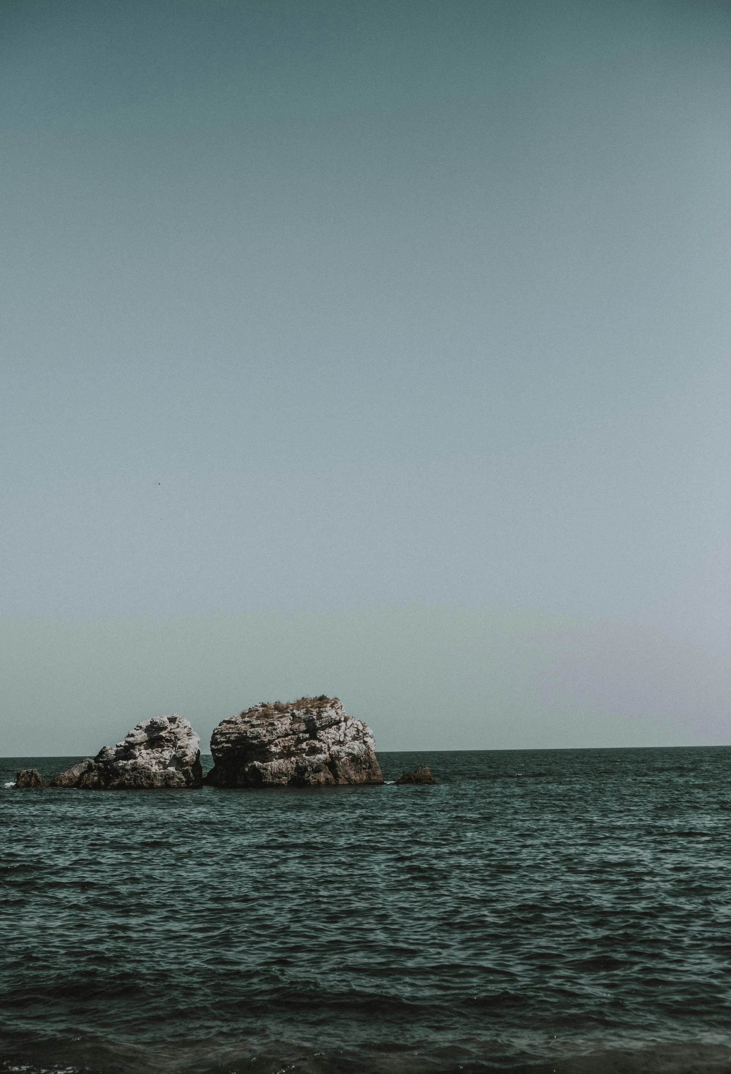 Big rock in the ocean.