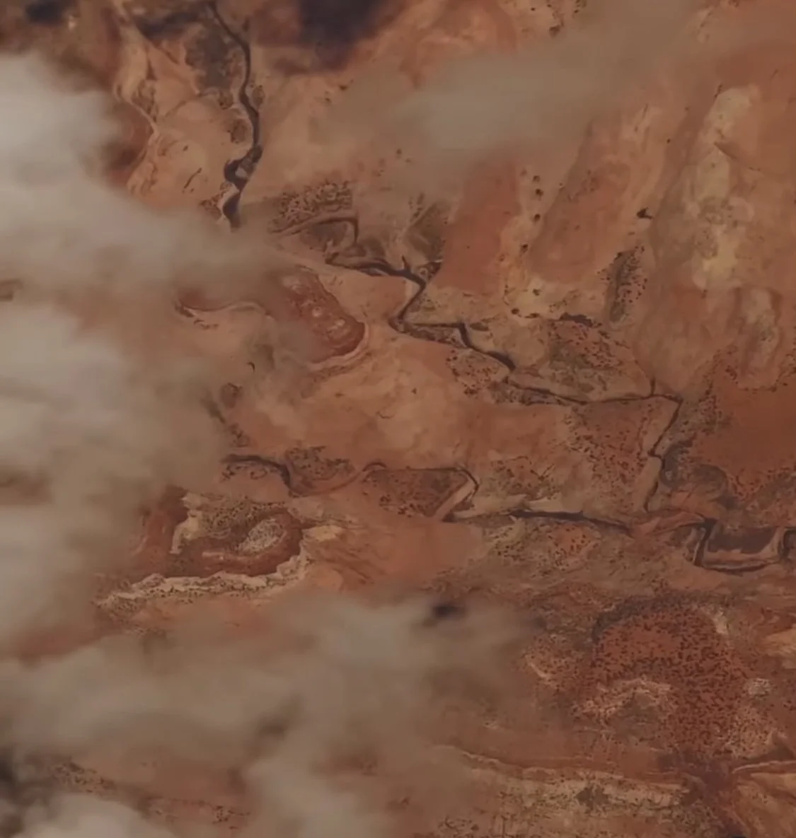 Red rock with clouds.