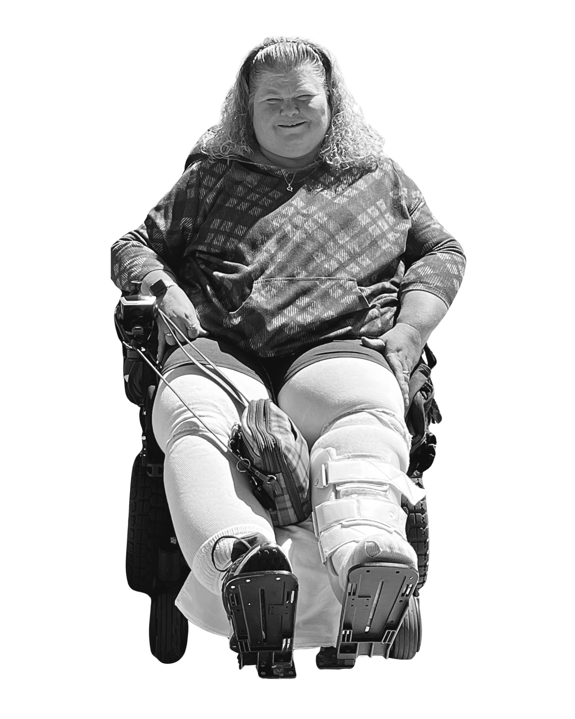 Springfield tenant Jami, sitting in her wheelchair looking at the camera and smiling