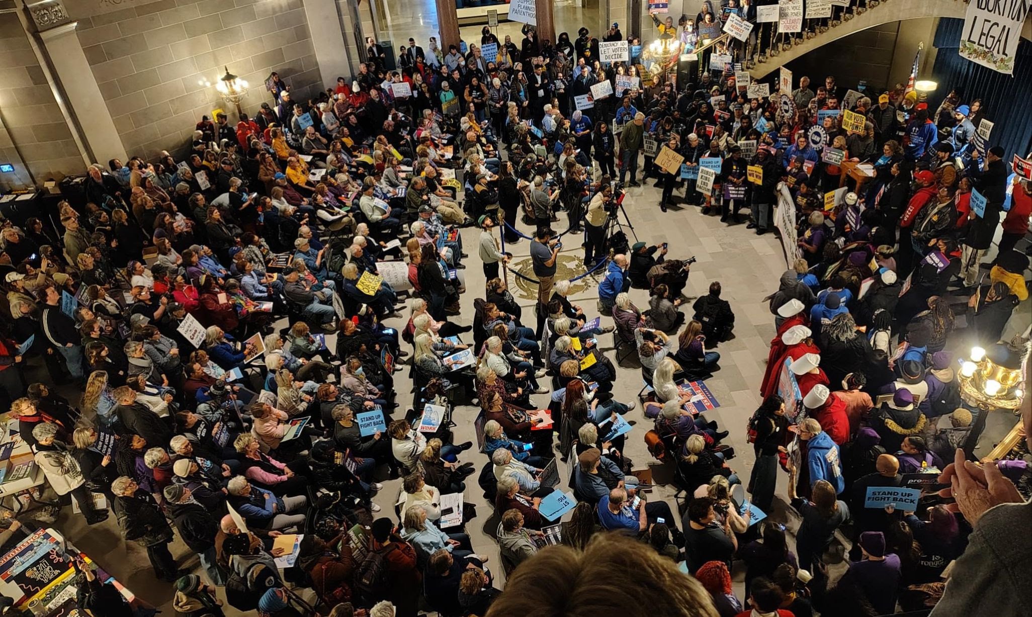 This image portrays a massive group of Missouri voters crowded in the front Assembly hall at the Missouri State Capital building in Jefferson City.