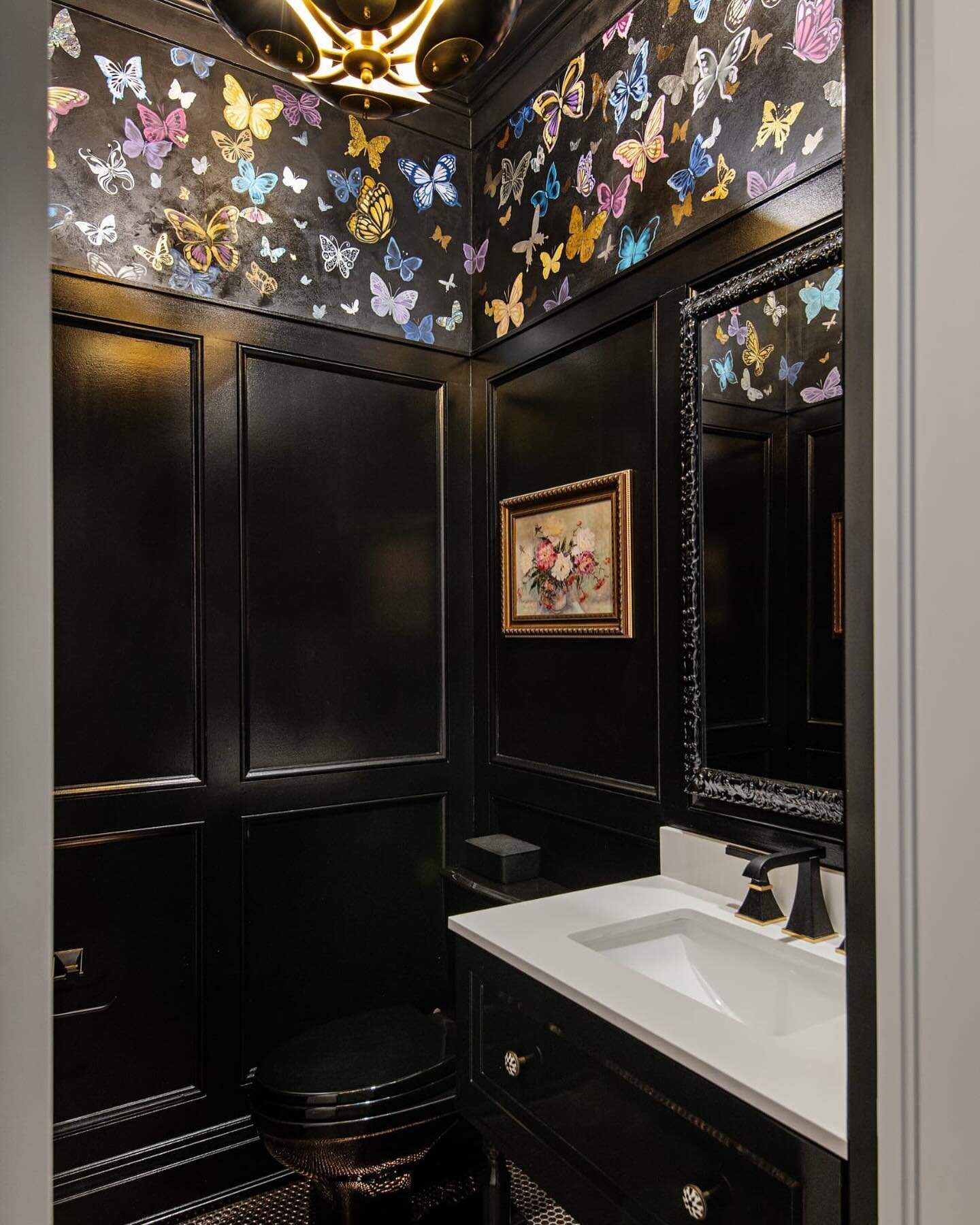 A JEWEL OF A POWDER ROOM 
The smallest room in the house is an opportunity to go big on fun and glam.
Black shimmering plaster with literally almost 200 hand painted and gilded butterflies.  Also included are mother of pearl veneer, abalone shell ven