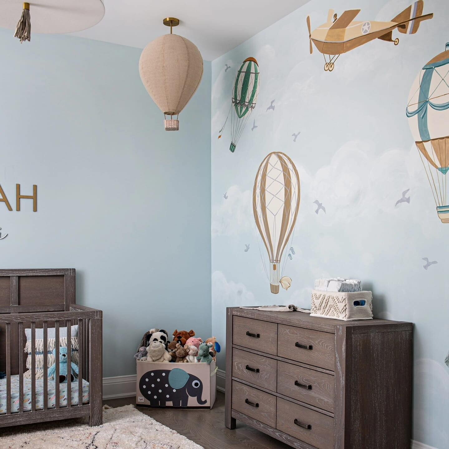 UP UP AND AWAY this nursery was so much fun to do with my trusty side kick @thepaintinggreek.  Soft colours with a vintage story book feel makes this room calm and serene.  The big comfy green chair can easily stay in the room as this child grows.  I