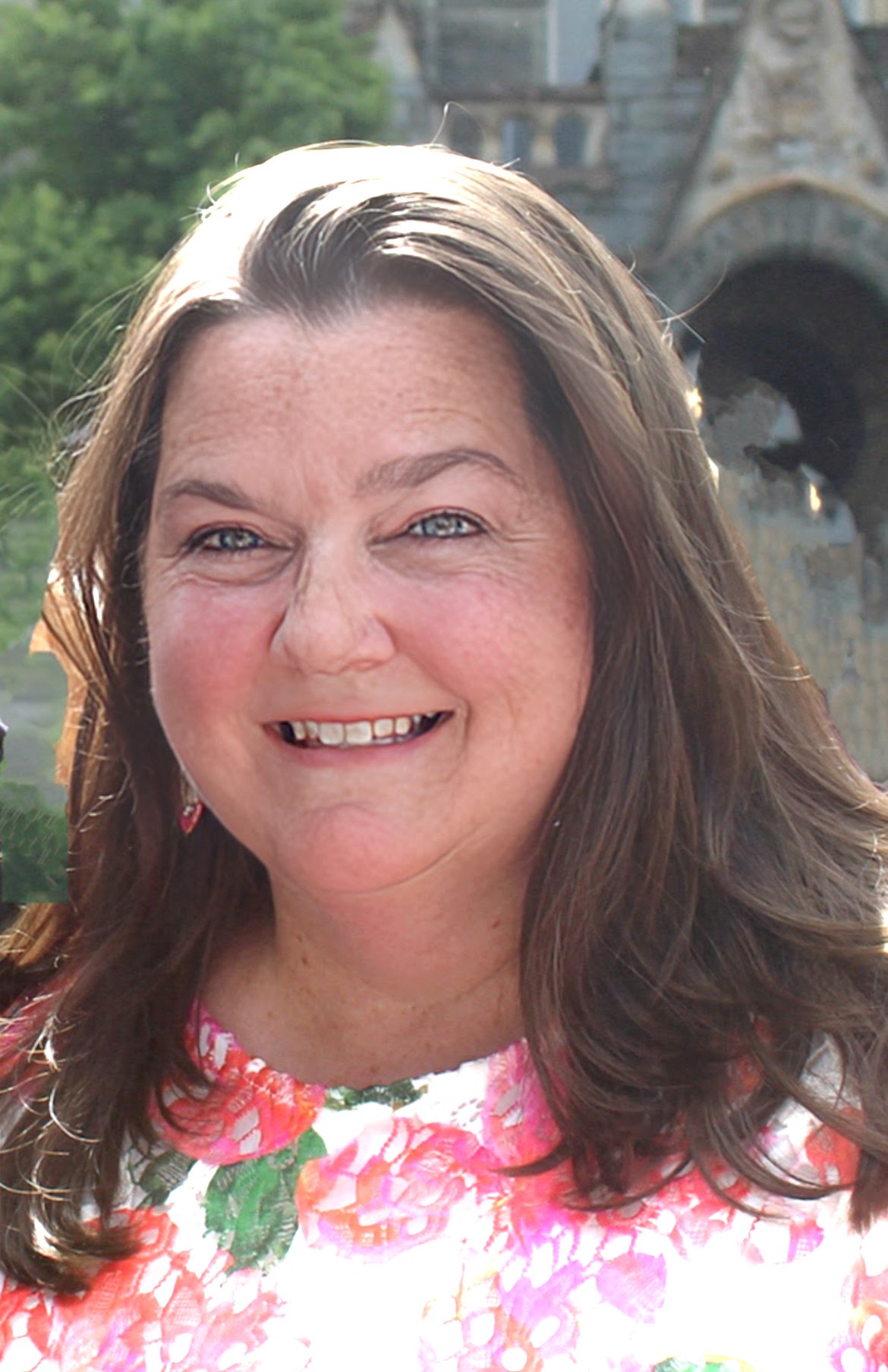 Close-up headshot of a author Maura McGee.
