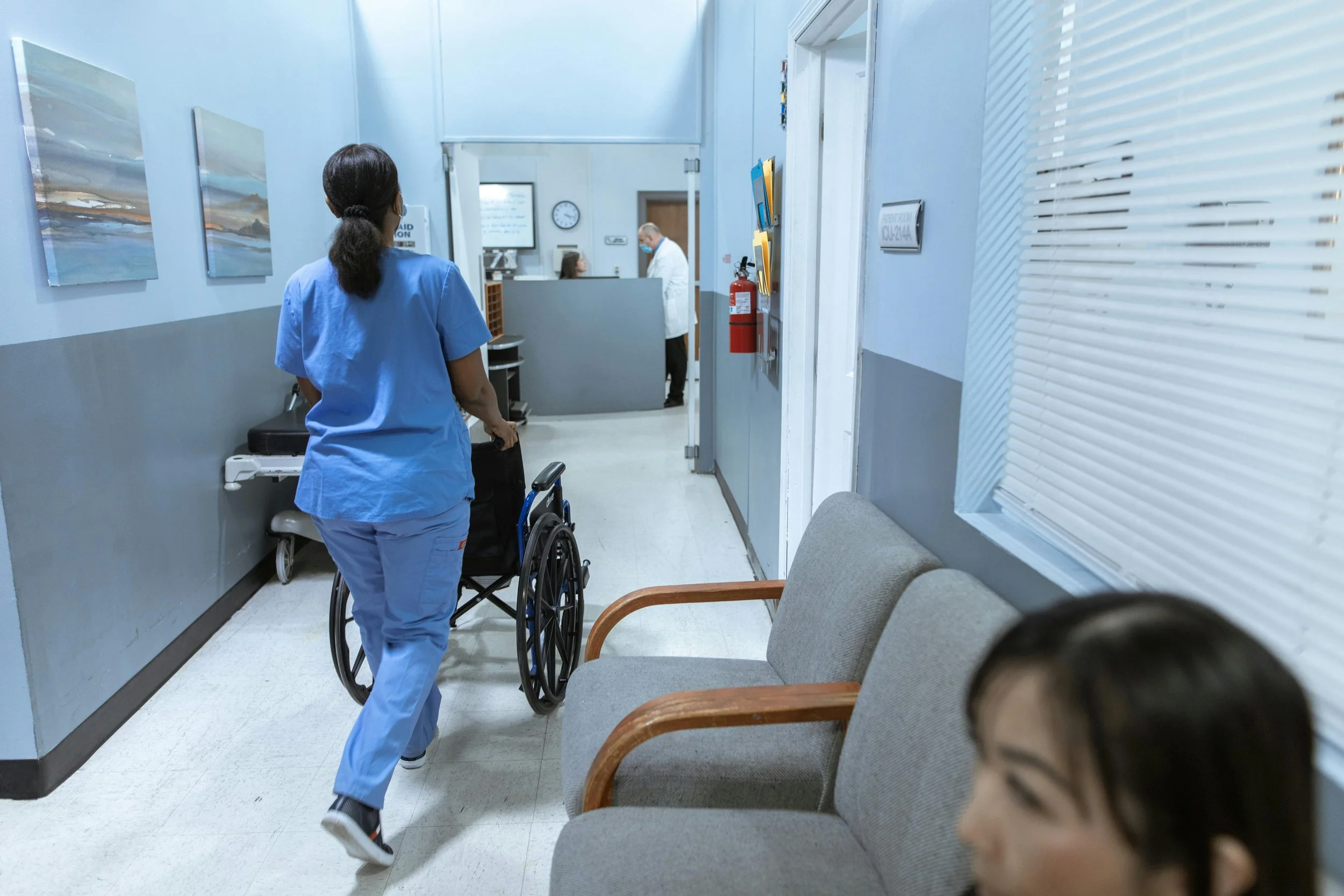 Woman working in a busy hospital NHS