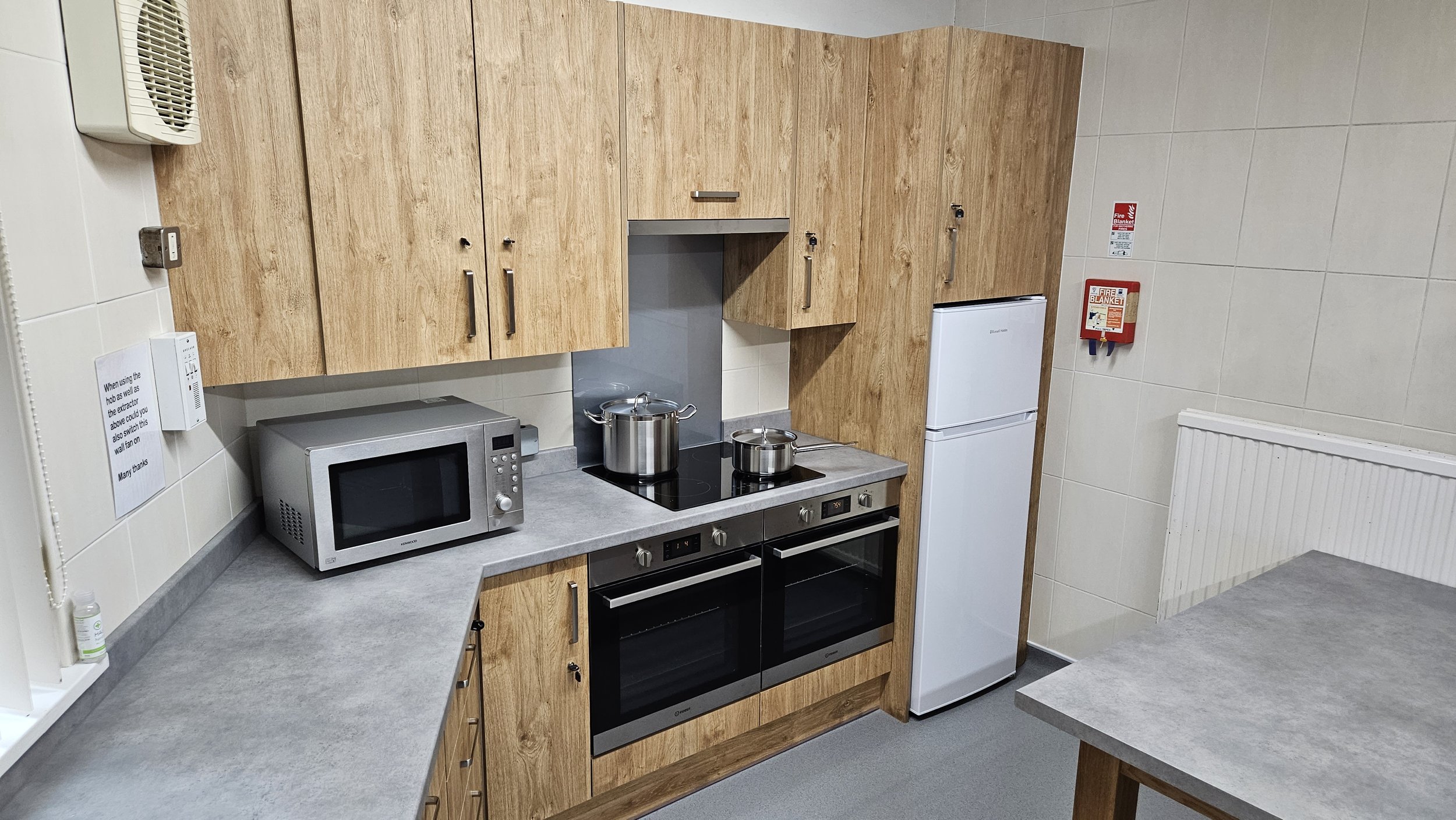 We have a kitchen with fridge/freezer, induction hob, two domestic sized ovens