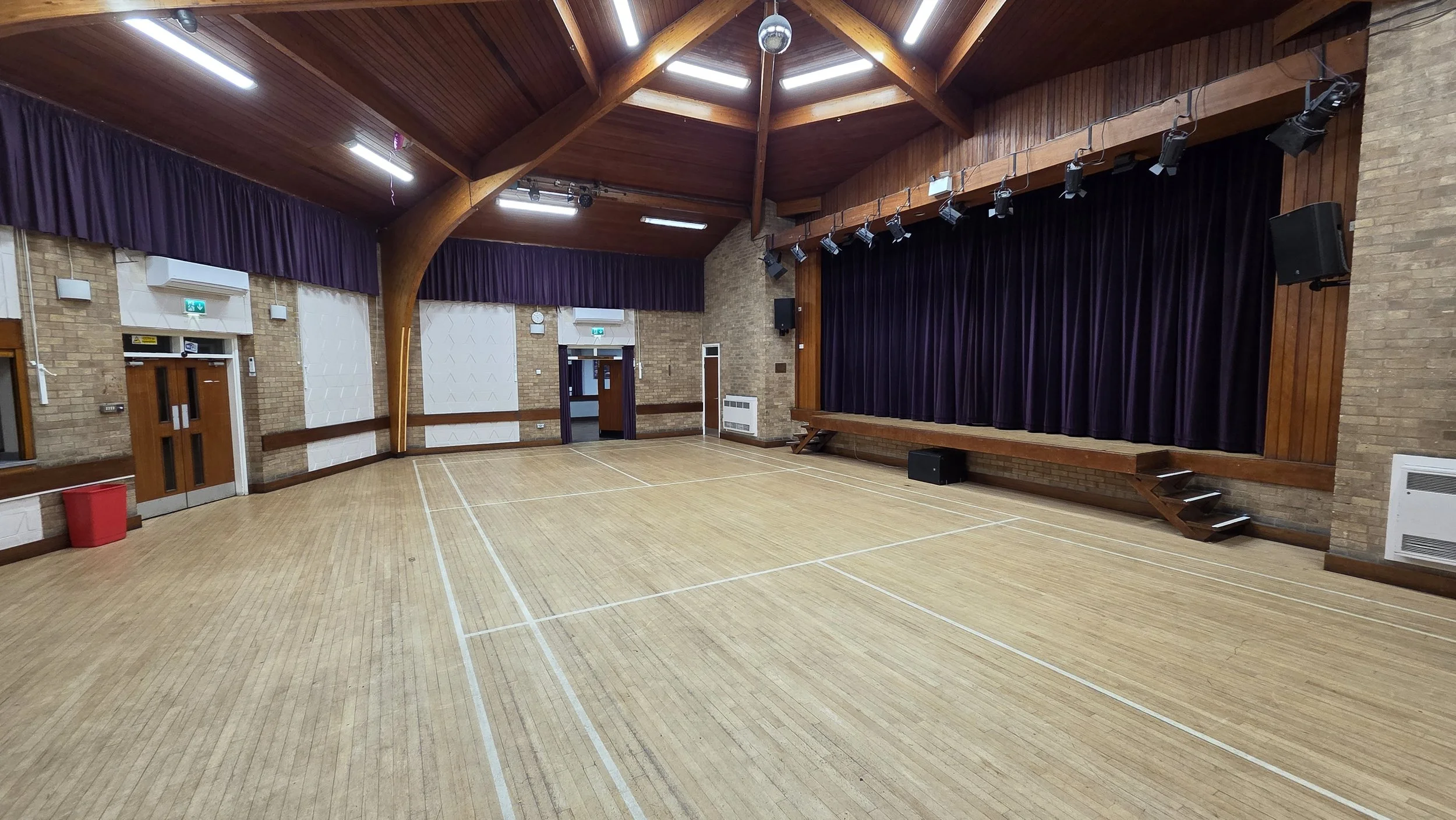 This is the main hall with the main entrance doors from the lobby on the left.