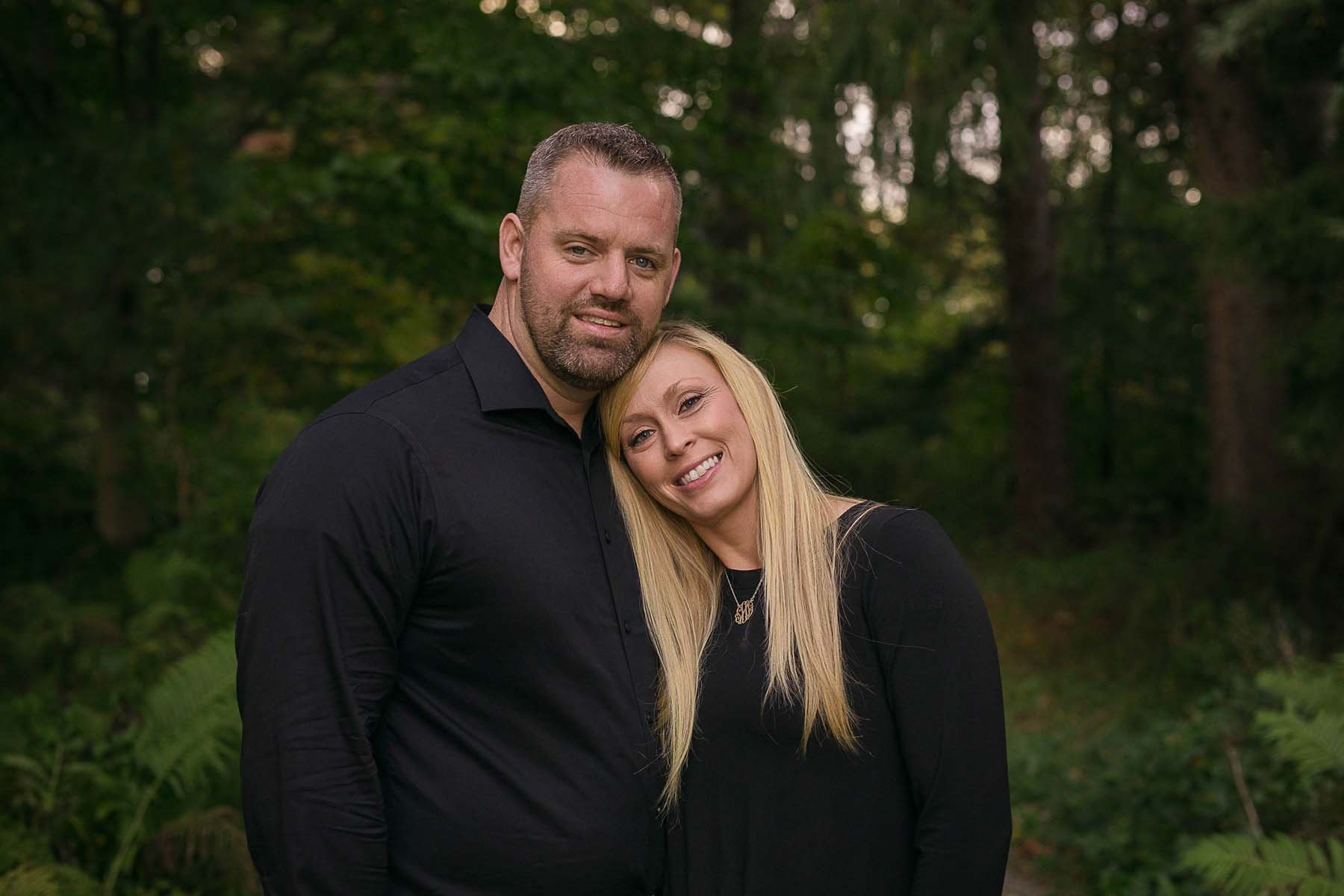 Couple Posed in woods for Family Portrait in Huntingdon Valley PA by photographer Wonderland Portrait