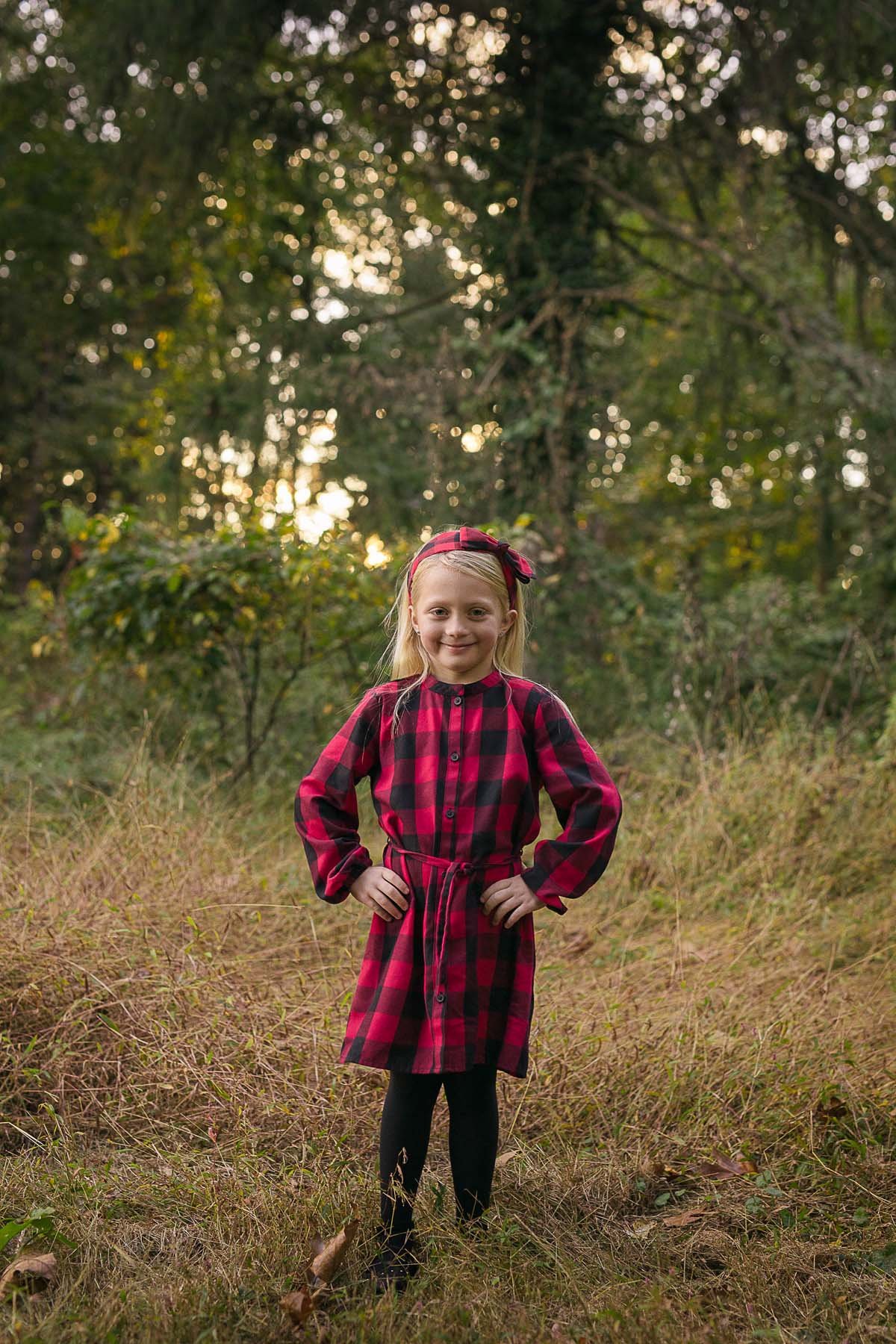 Girl Posed in a Field for Family Portrait in Huntingdon Valley PA by photographer Wonderland Portrait