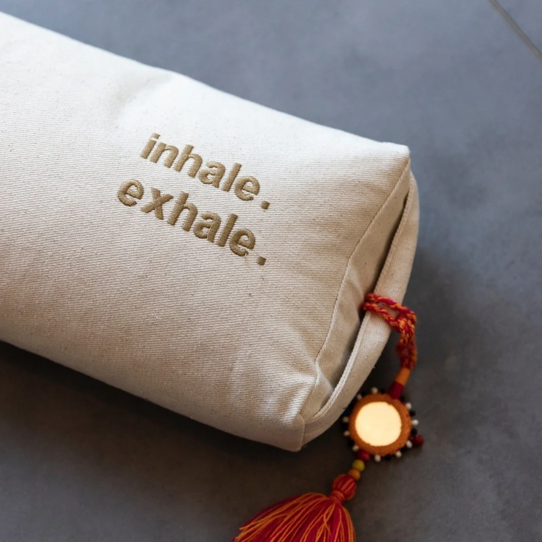 Bolster with written on it "inhale. Exhale"
